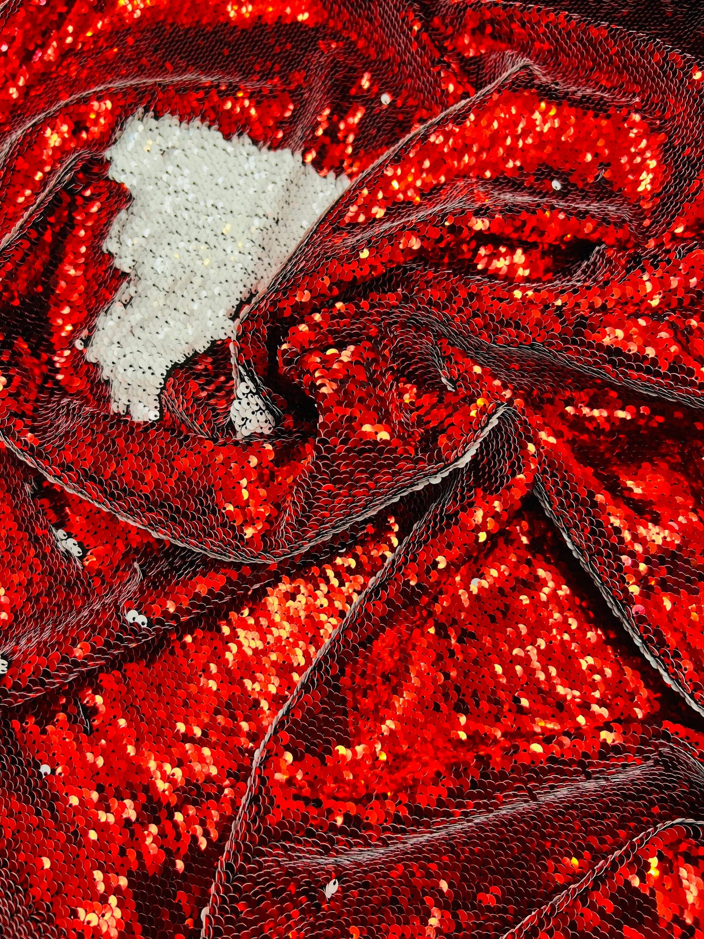 Mermaid sequins red/white reversible sequins embroidered on spandex base 2-way stretch 55/57” Sold by the YD. Ships Worldwide from Los Angel