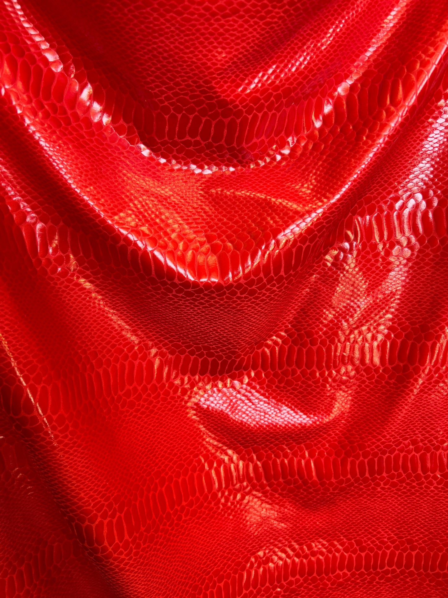 New Anaconda iridescent clear foil on poly spandex 2-way stretch medium weight 58/60” Sold by the YD. Ships Worldwide from Los Angeles Calif