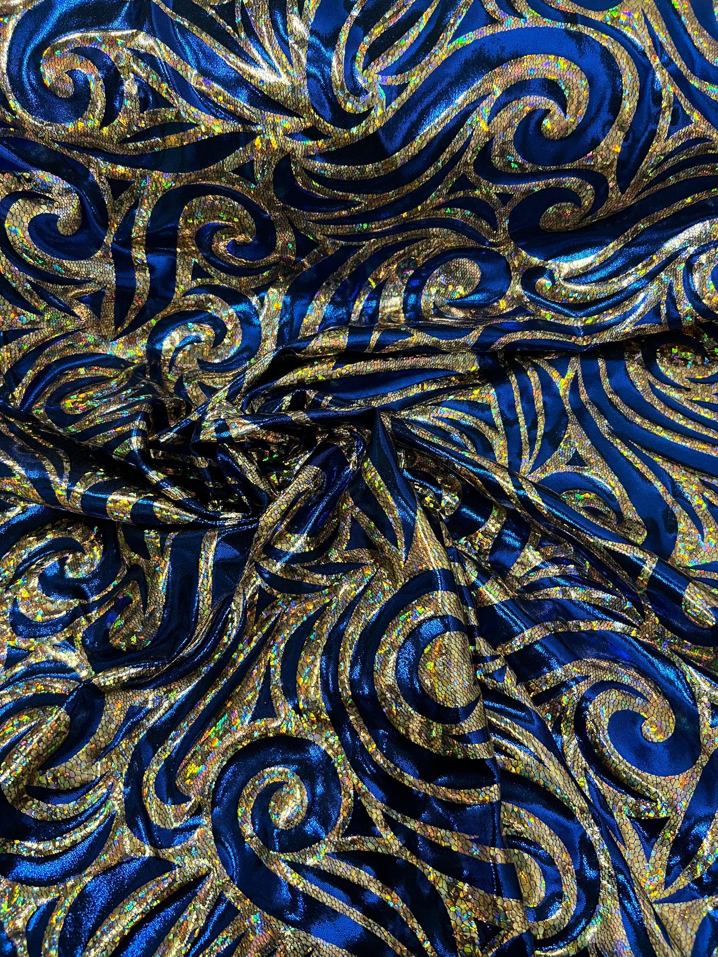 Rolex Luxury swirl design hologram metallic nylon spandex 4-way stretch Midnight Blue/Gold 58/60” Sold by the YD. Ships Worldwide from L.A