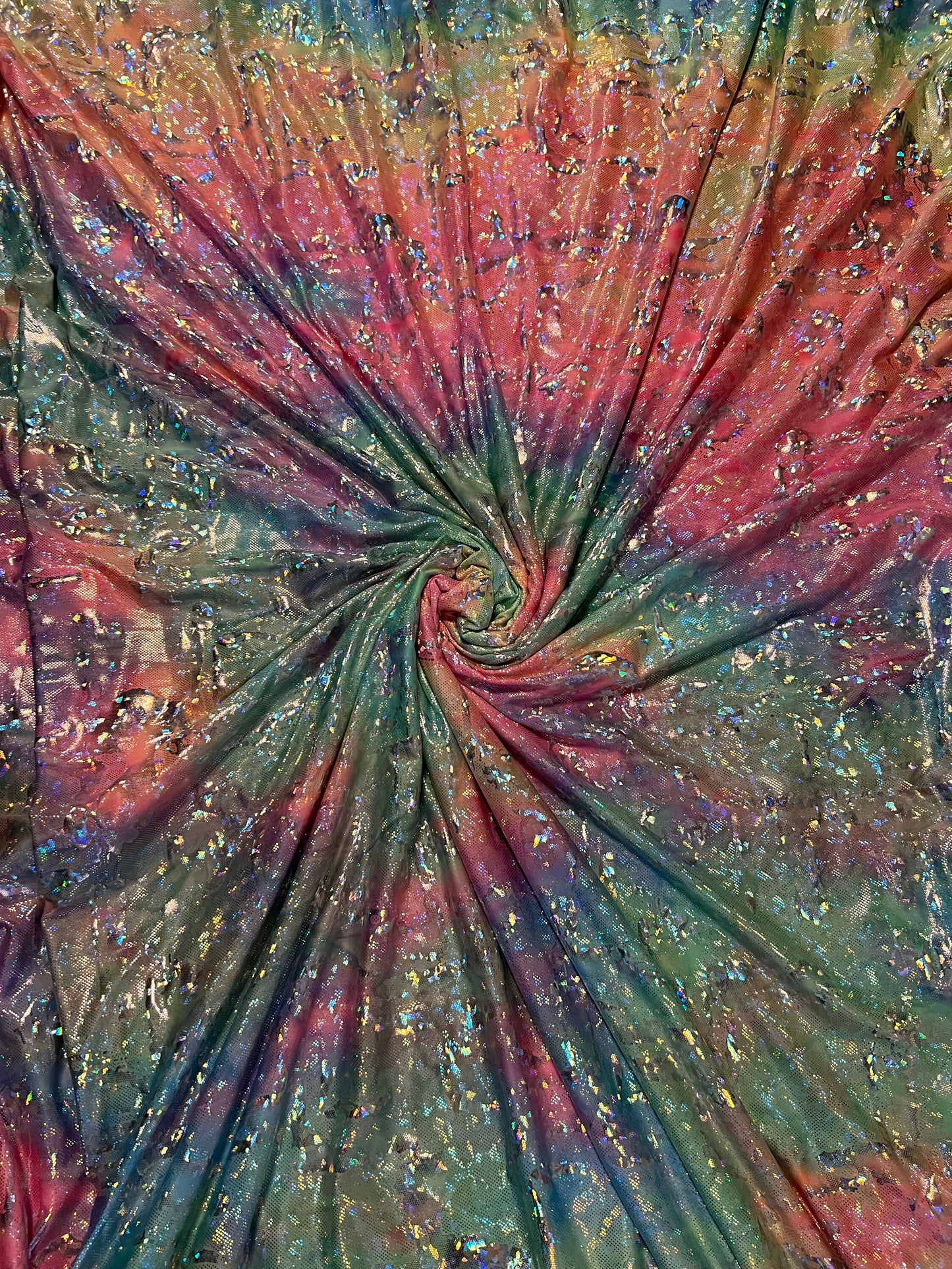 New abstract design hologram metallic poly spandex Rainbow multi pastel colors 2-way stretch 58/60” Sold by the YD.