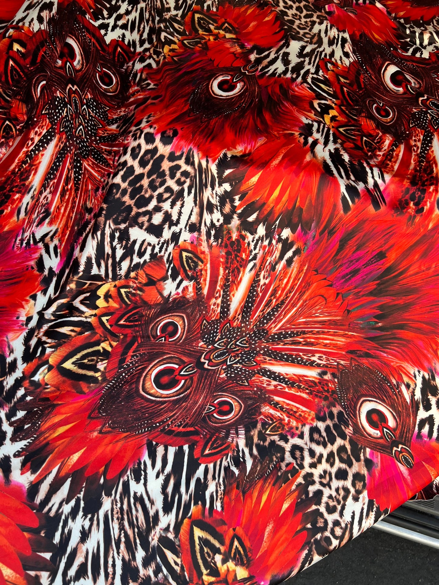 Hiding Leopard & Peacock design exotic animal print on yoga poly spandex 4-way stretch 58/60” Sold by the YD. Ships Worldwide