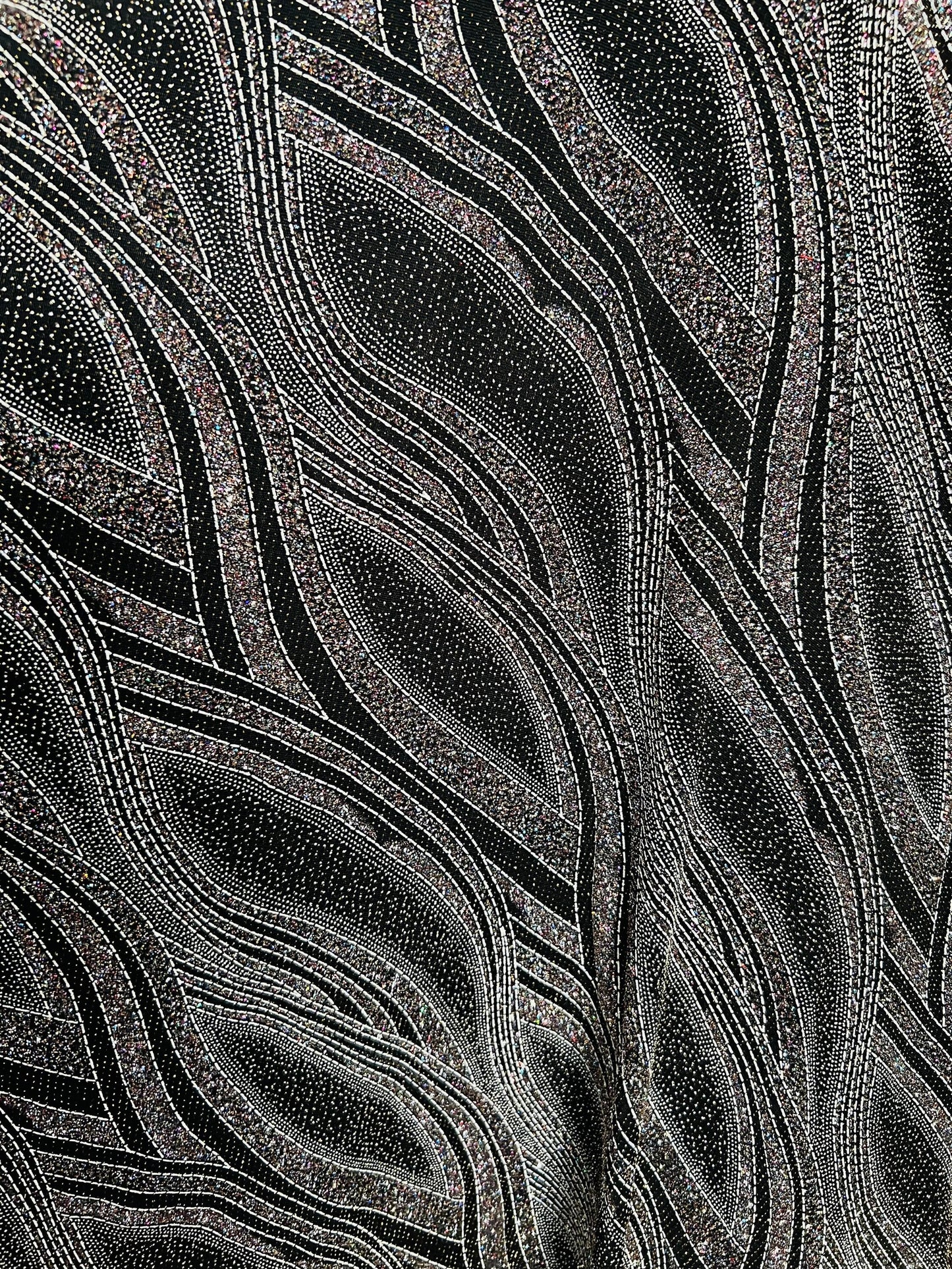 New abstract design metallic slinky 4-way stretch glitter fabric 58/60” Sold by the YD. Ships Worldwide from Los Angeles California USA.