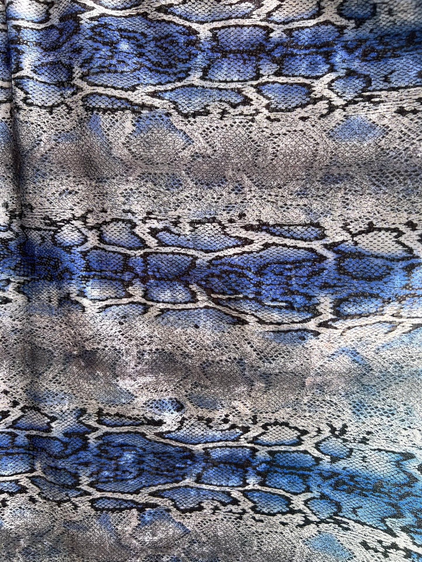 Exotic Snake design with clear foil on poly Interlock 2way stretch 58/60” Sold by the YD. Ships worldwide from Los Angeles California USA.