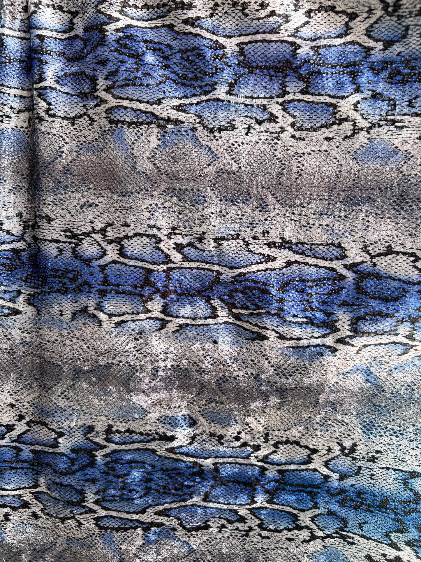Exotic Snake design with clear foil on poly Interlock 2way stretch 58/60” Sold by the YD. Ships worldwide from Los Angeles California USA.