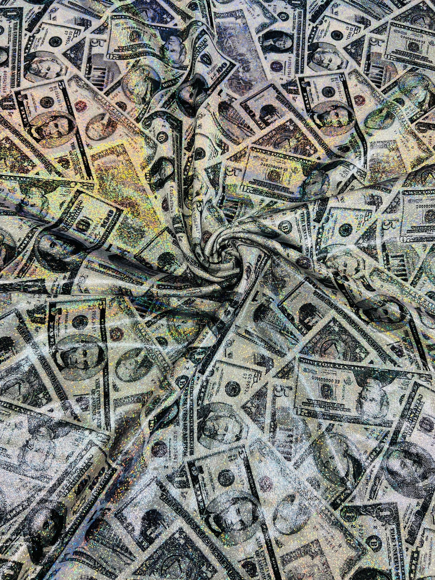 New Money design Multi dollars design hologram metallic tie dye nylon spandex 4-way stretch 58/60” Sold by the YD. Ships worldwide