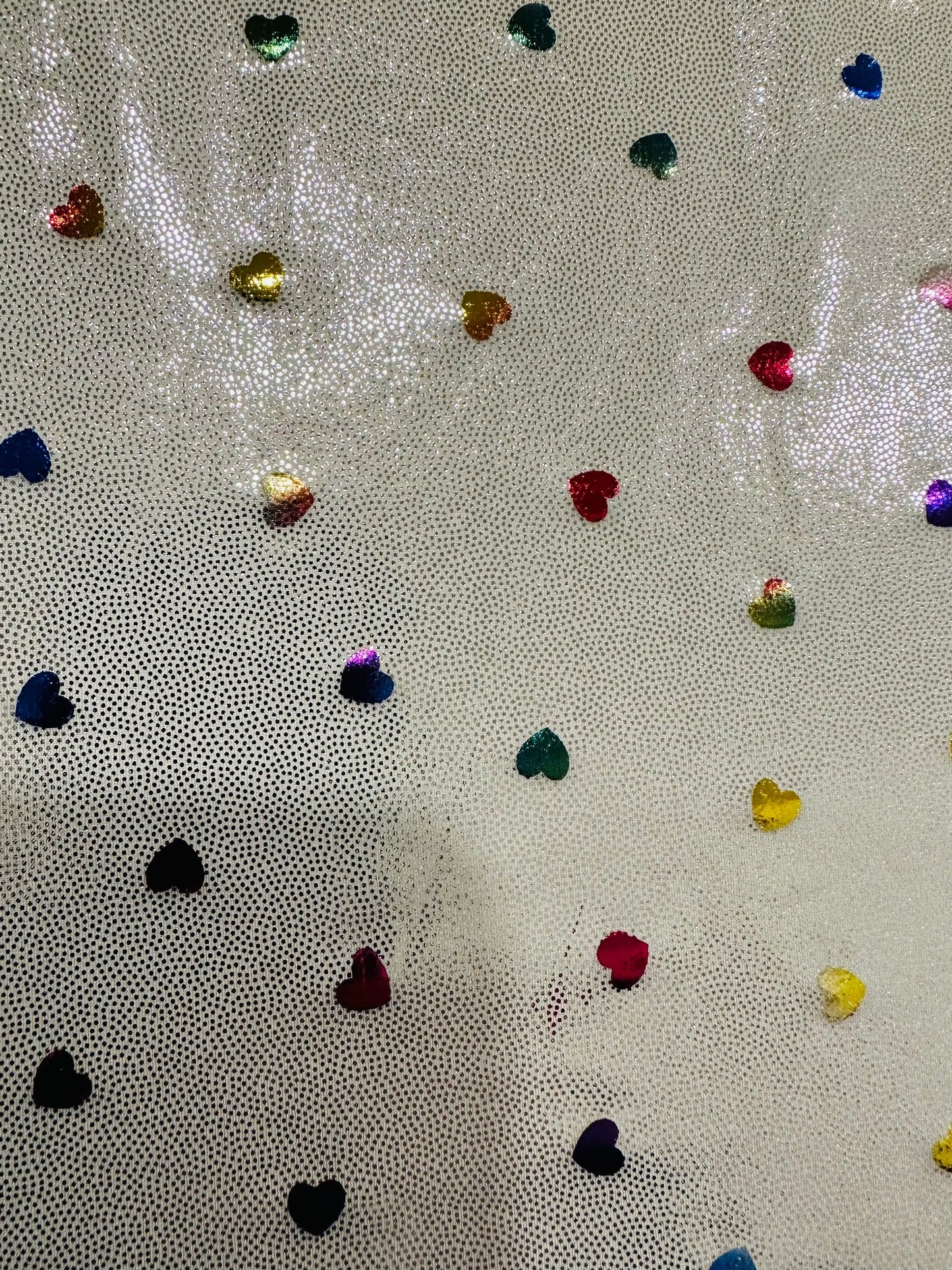 Hearts design metallic hologram nylon spandex W/Silver multicolor 4-way stretch spandex 58/60” Sold by the YD. Ships worldwide from L.A
