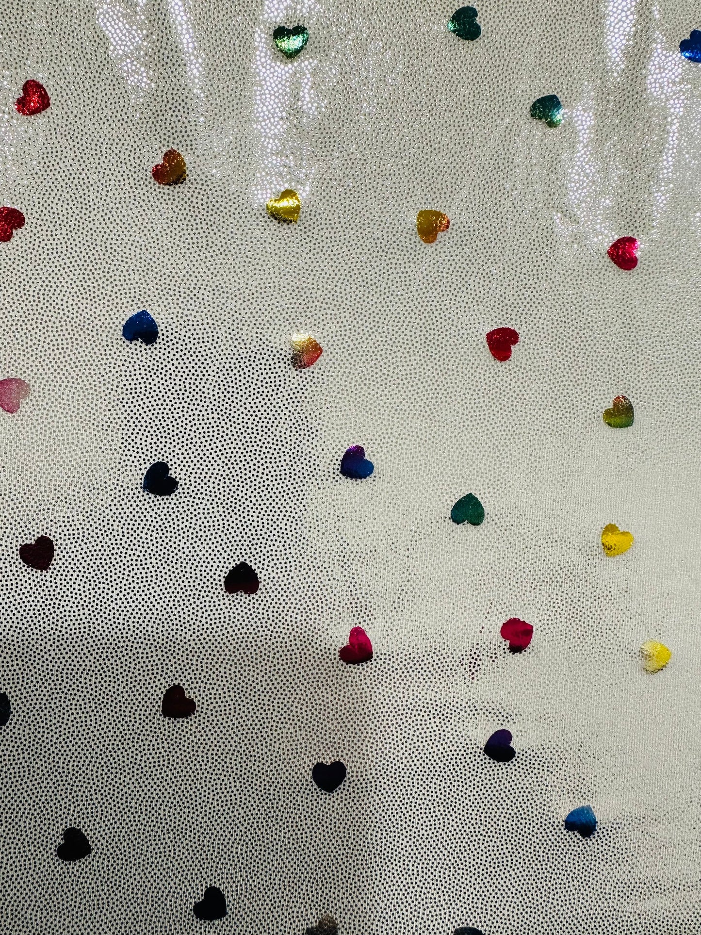 Hearts design metallic hologram nylon spandex W/Silver multicolor 4-way stretch spandex 58/60” Sold by the YD. Ships worldwide from L.A