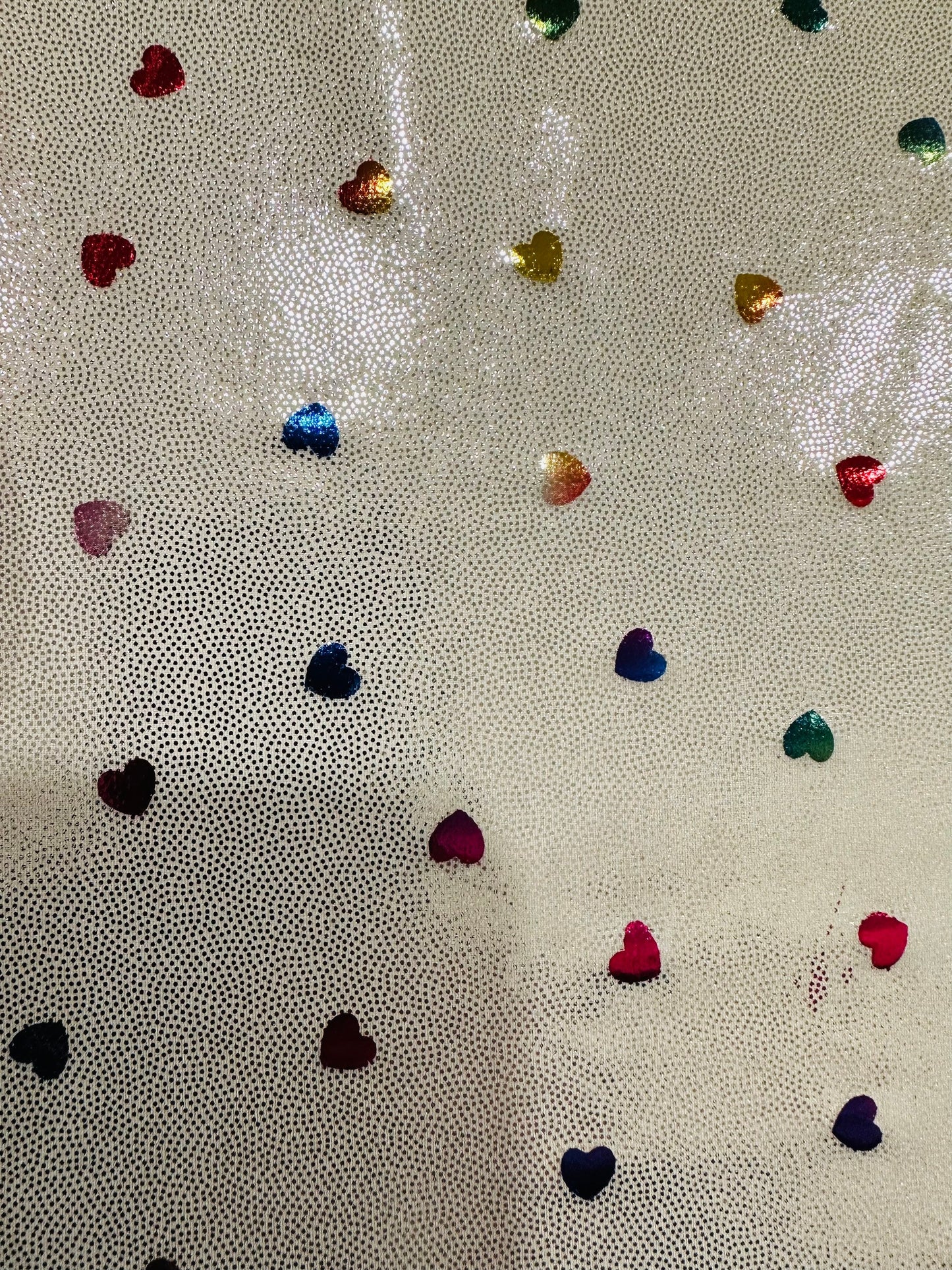 Hearts design metallic hologram nylon spandex W/Silver multicolor 4-way stretch spandex 58/60” Sold by the YD. Ships worldwide from L.A