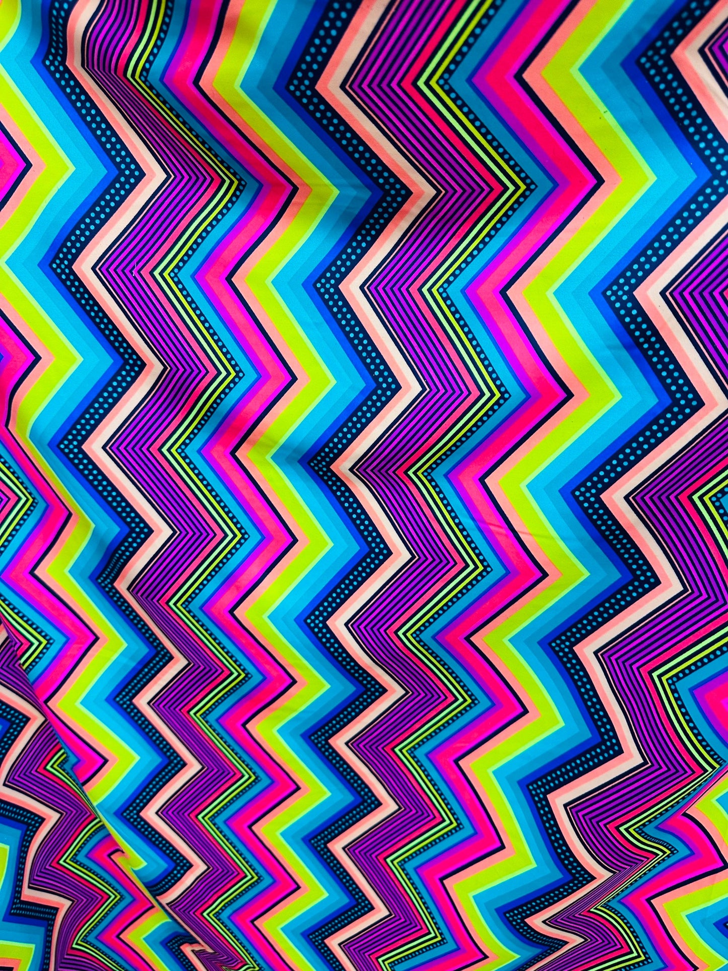 Zigzag abstract design rainbow color print on best quality of nylon spandex 4-way stretch 58/60” Sold by the YD.