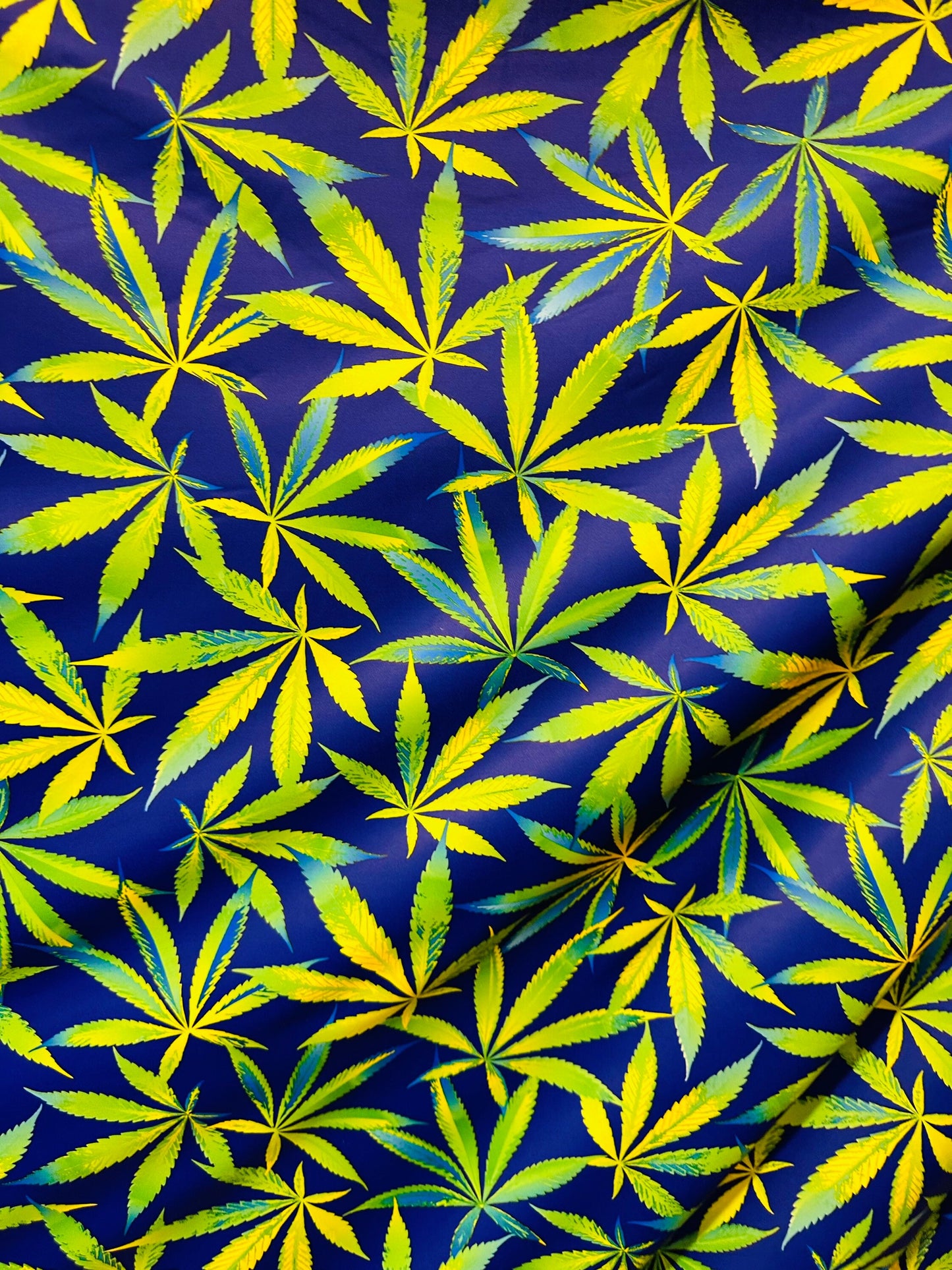 Marihuana leaf design multicolor print on best quality of nylon spandex 4-way stretch 58/60” Sold by the YD. Ships worldwide from L.A