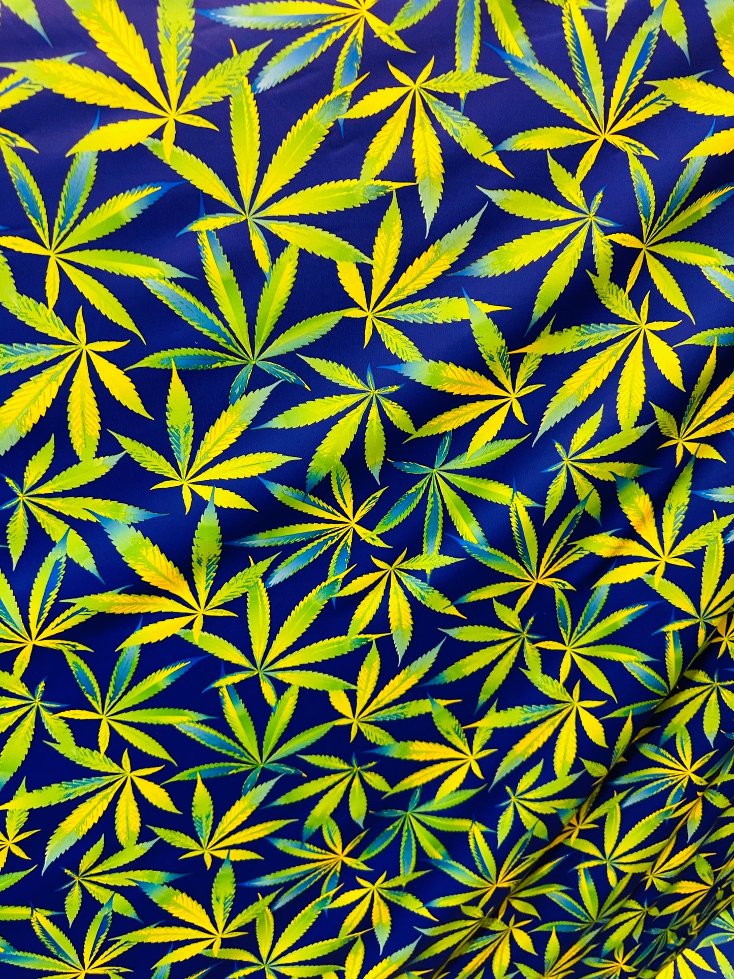 Marihuana leaf design multicolor print on best quality of nylon spandex 4-way stretch 58/60” Sold by the YD. Ships worldwide from L.A
