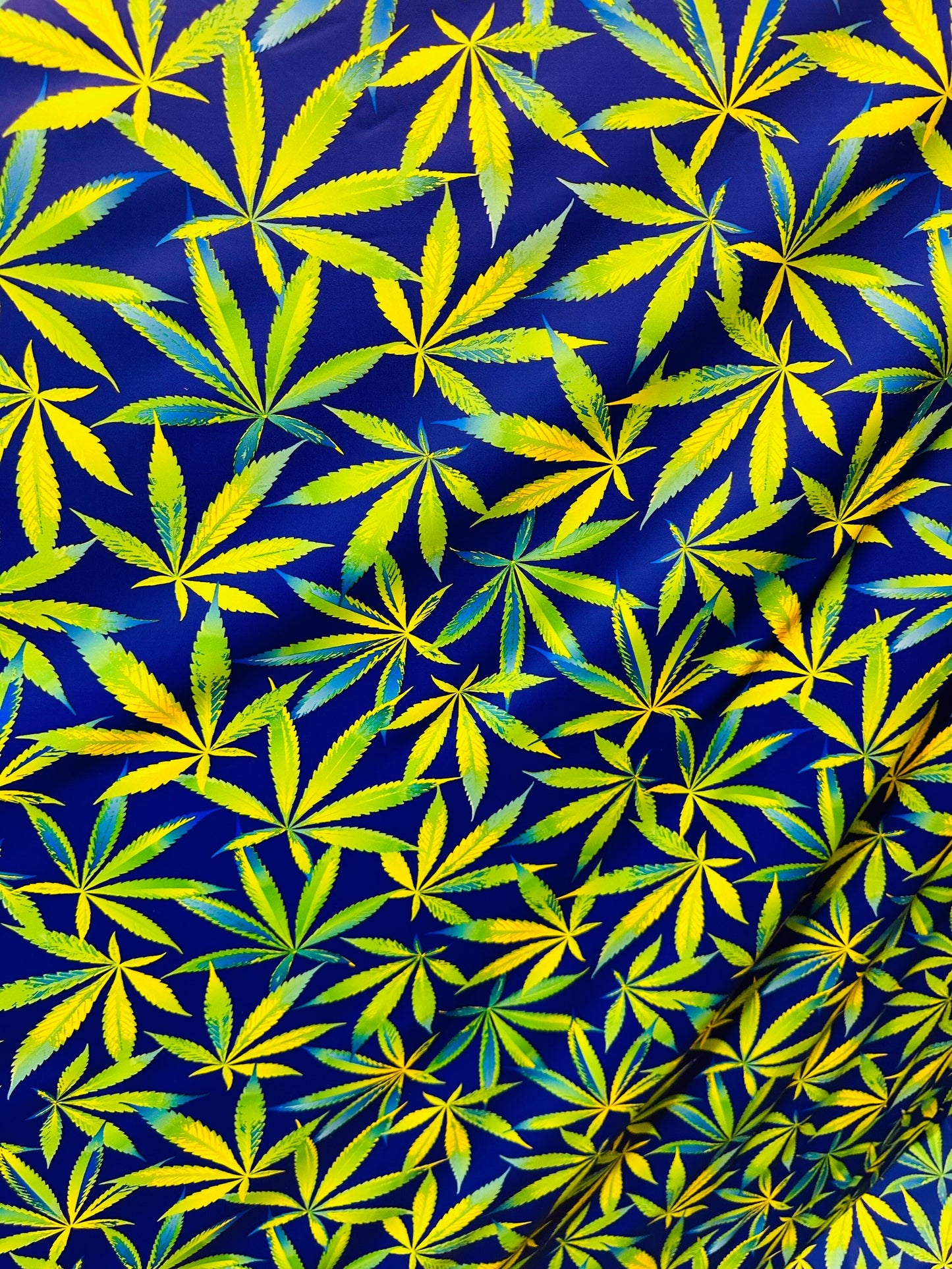 Marihuana leaf design multicolor print on best quality of nylon spandex 4-way stretch 58/60” Sold by the YD. Ships worldwide from L.A