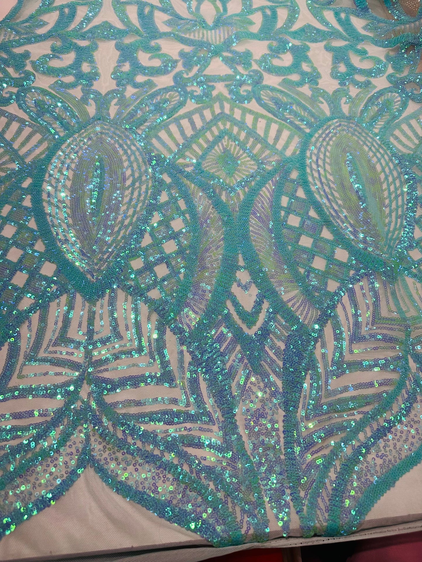 New Luxury Jlo sequins design Tiffany blue embroidered on stretch power mesh 4-way stretch 55/57” Sold by the YD. Ships worldwide from L.A