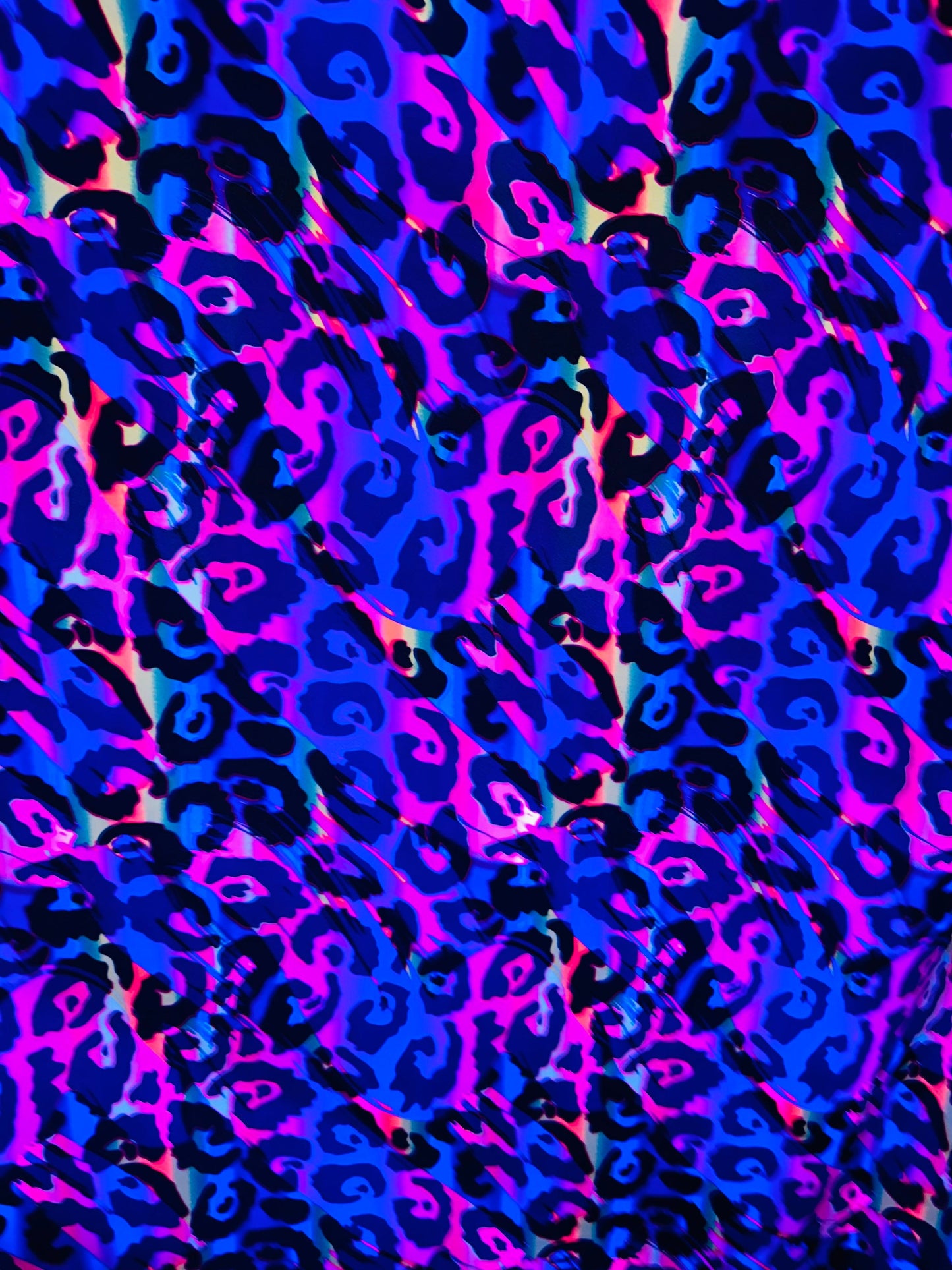Wildcat design multicolor print on best quality of nylon spandex 4-way stretch UV light it glows under black light 58/60” Sold by the YD.