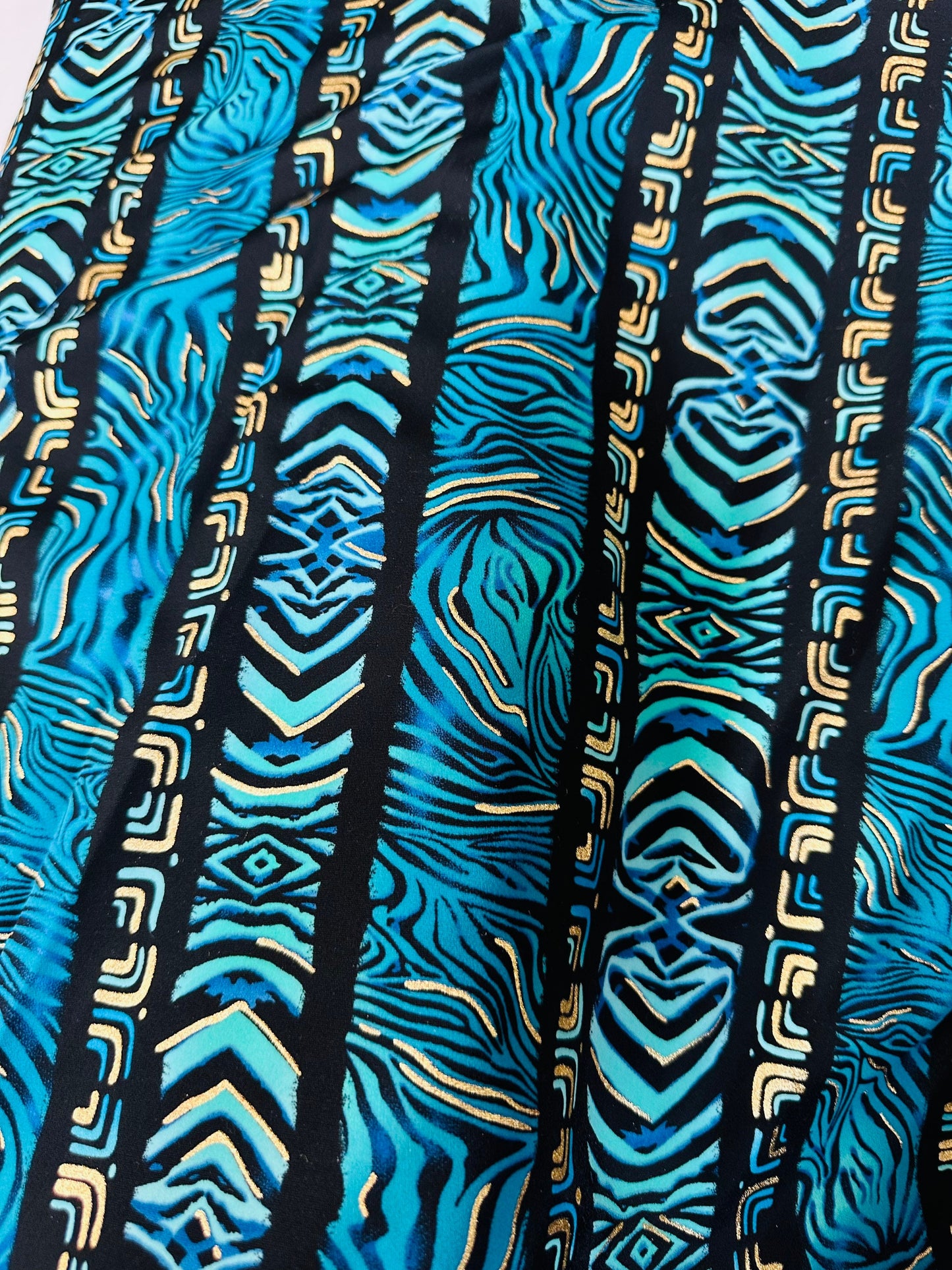 Exotic zebra design on best quality of nylon spandex with gold foil 4-way stretch 58/60” Sold by the YD.