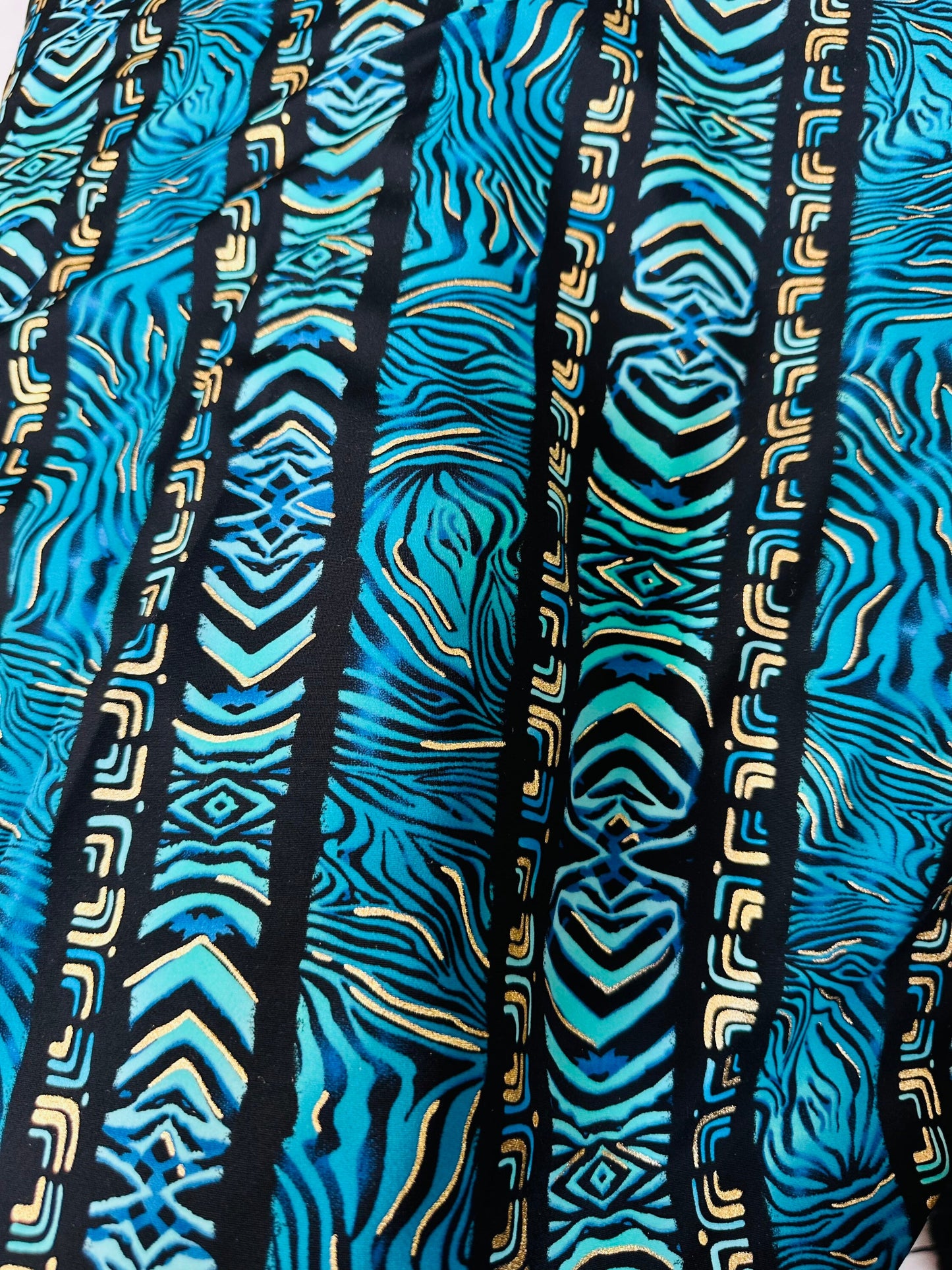 Exotic zebra design on best quality of nylon spandex with gold foil 4-way stretch 58/60” Sold by the YD.