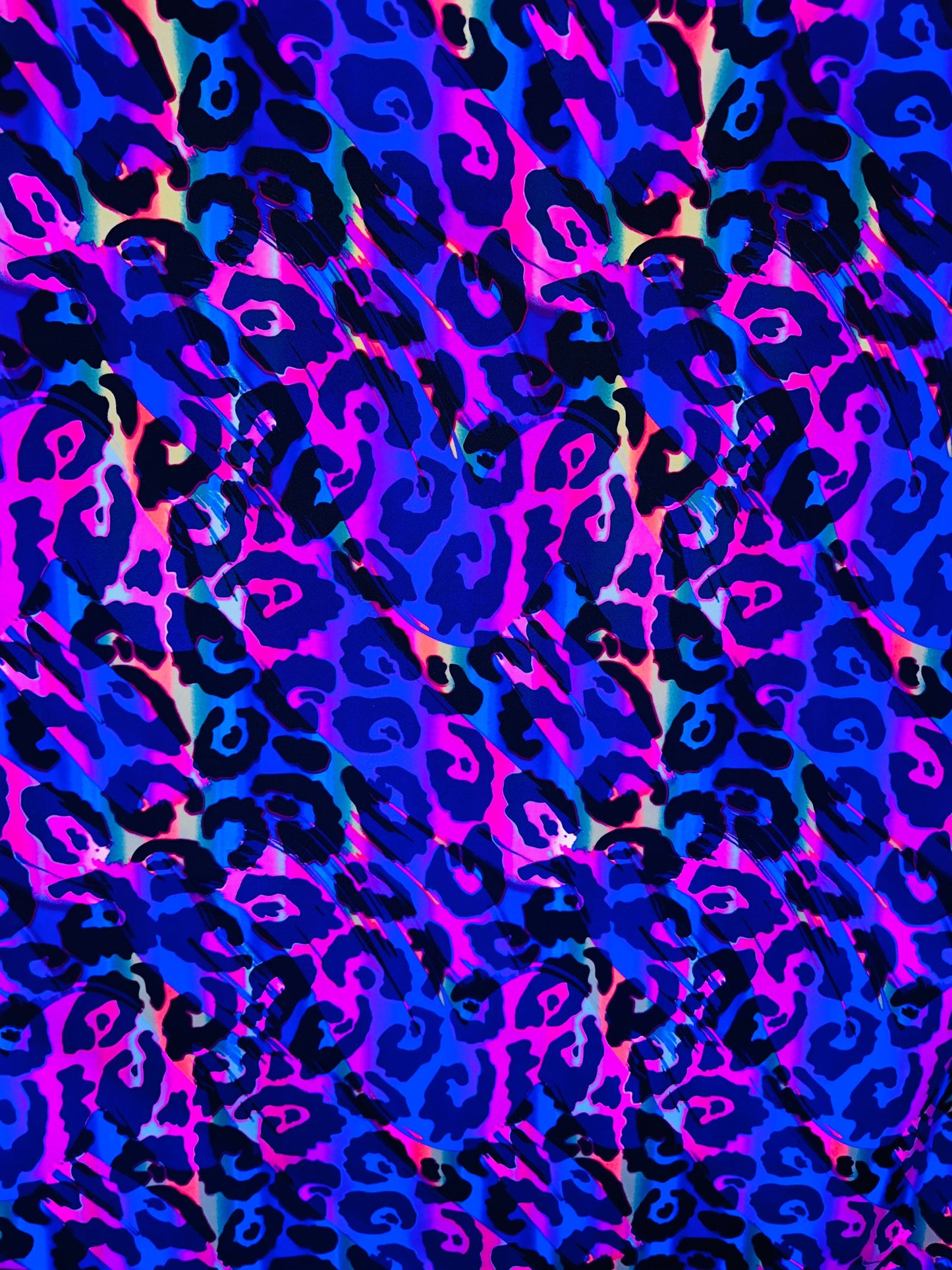 Wildcat design multicolor print on best quality of nylon spandex 4-way stretch UV light it glows under black light 58/60” Sold by the YD.