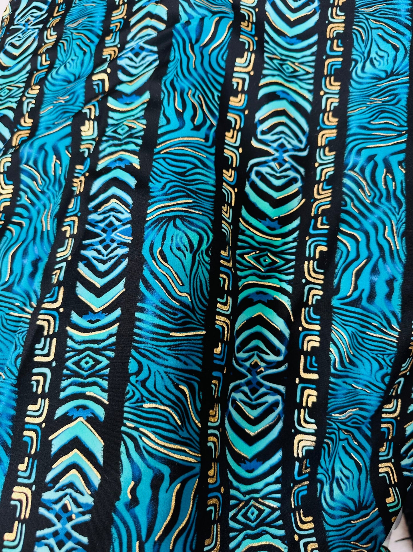 Exotic zebra design on best quality of nylon spandex with gold foil 4-way stretch 58/60” Sold by the YD.
