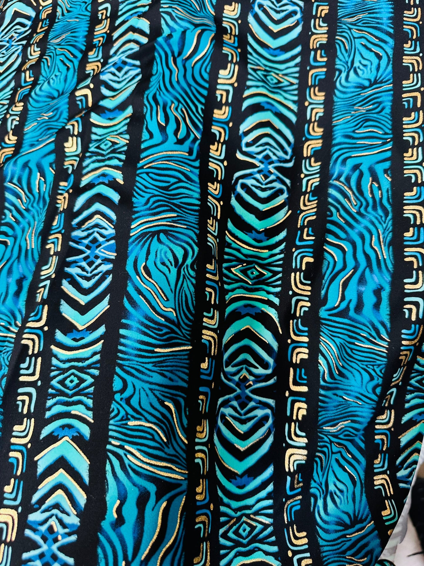 Exotic zebra design on best quality of nylon spandex with gold foil 4-way stretch 58/60” Sold by the YD.
