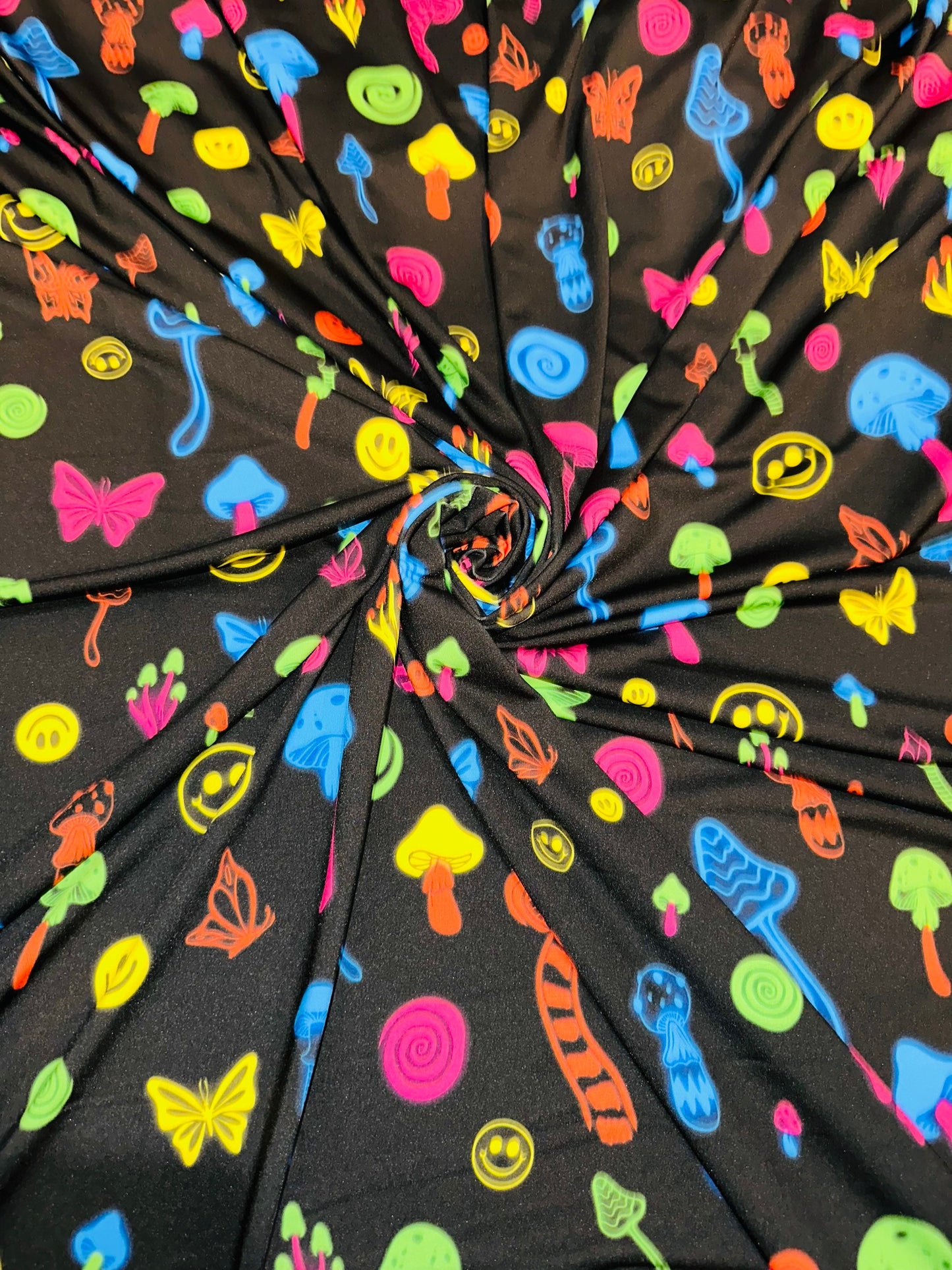 New Mushrooms and happy face design print on great quality of poly spandex 4-way stretch 58/60” Sold by the YD.