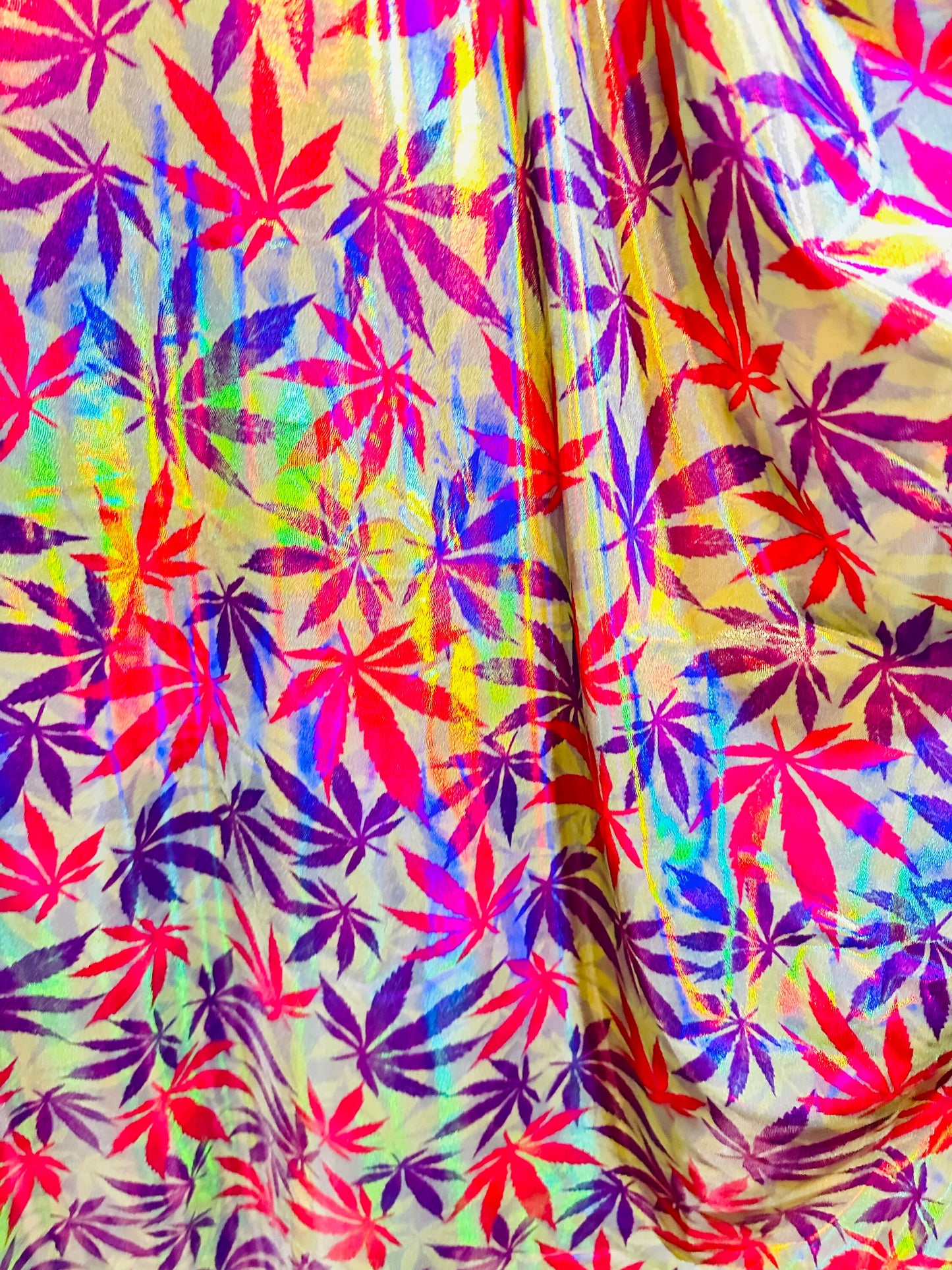 New Marijuana leaf design on Iridescent metallic nylon spandex with foggy foil 4-way stretch 58/60”