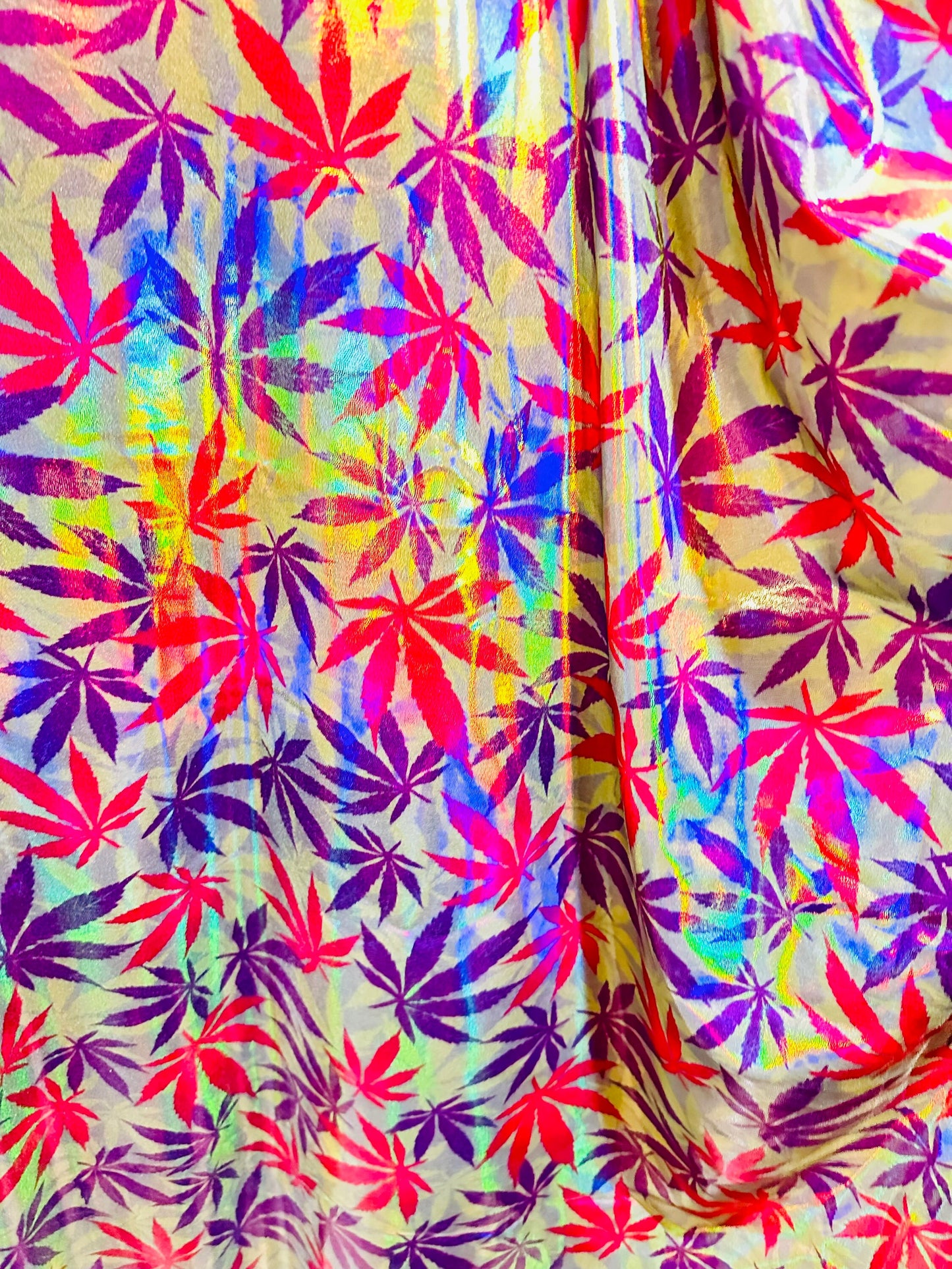 New Marijuana leaf design on Iridescent metallic nylon spandex with foggy foil 4-way stretch 58/60”