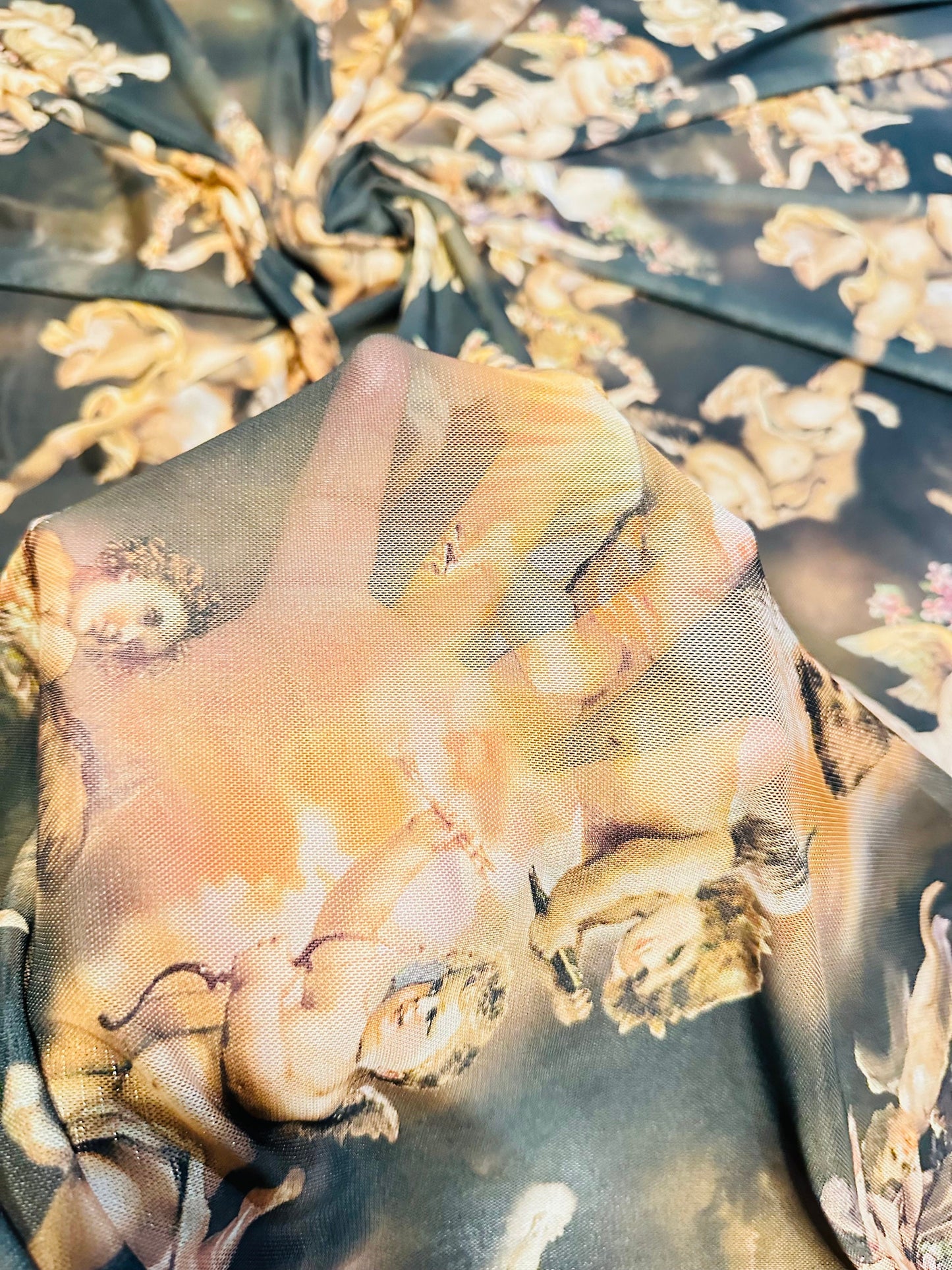 New Divine celestial Angels design Gold/Black color print on great quality of nylon power mesh 4-way stretch 58/60” Sold by the YD.