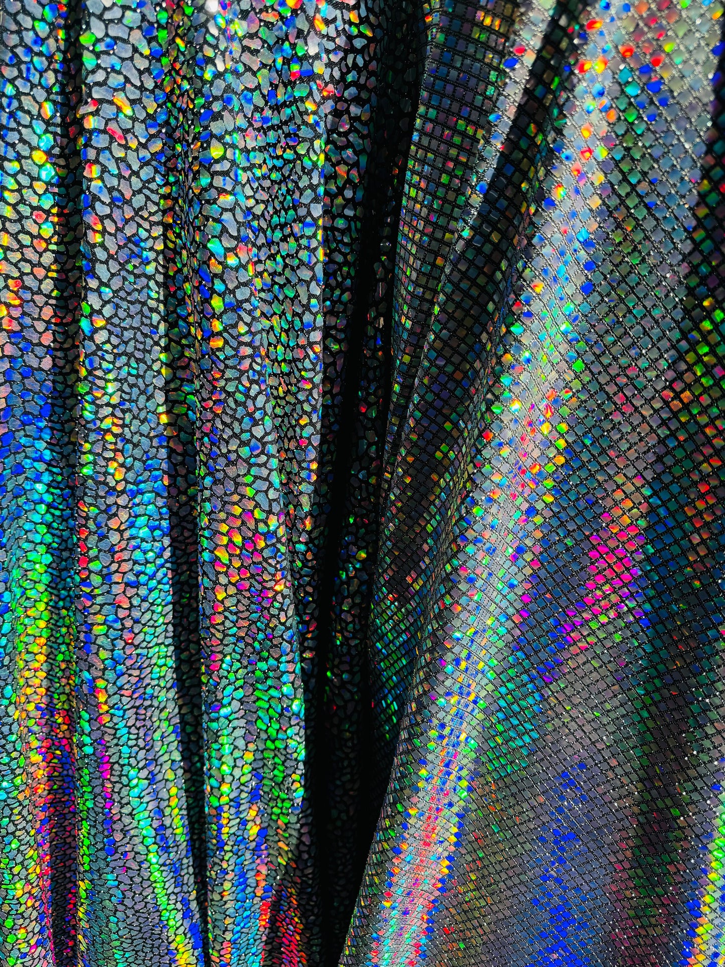 New Dragon and spectrum sequins on metallic spandex 4-way stretch 58/60” Sold by the YD. Ships Worldwide from Los Angeles California USA.
