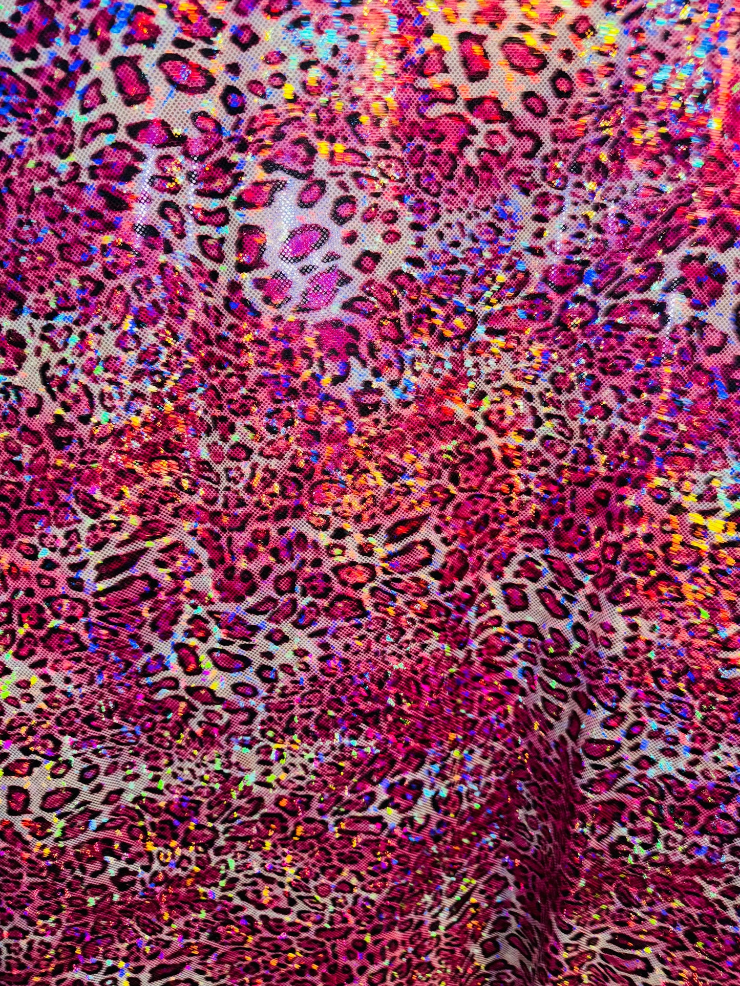 New Wild Leopard design on Hologram metallic nylon spandex 4-way stretch 58/60” Sold by the YD. Ships worldwide from Los Angeles CA