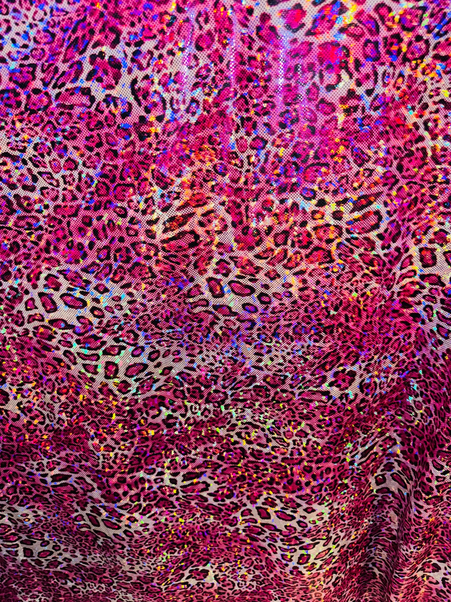 New Wild Leopard design on Hologram metallic nylon spandex 4-way stretch 58/60” Sold by the YD. Ships worldwide from Los Angeles CA