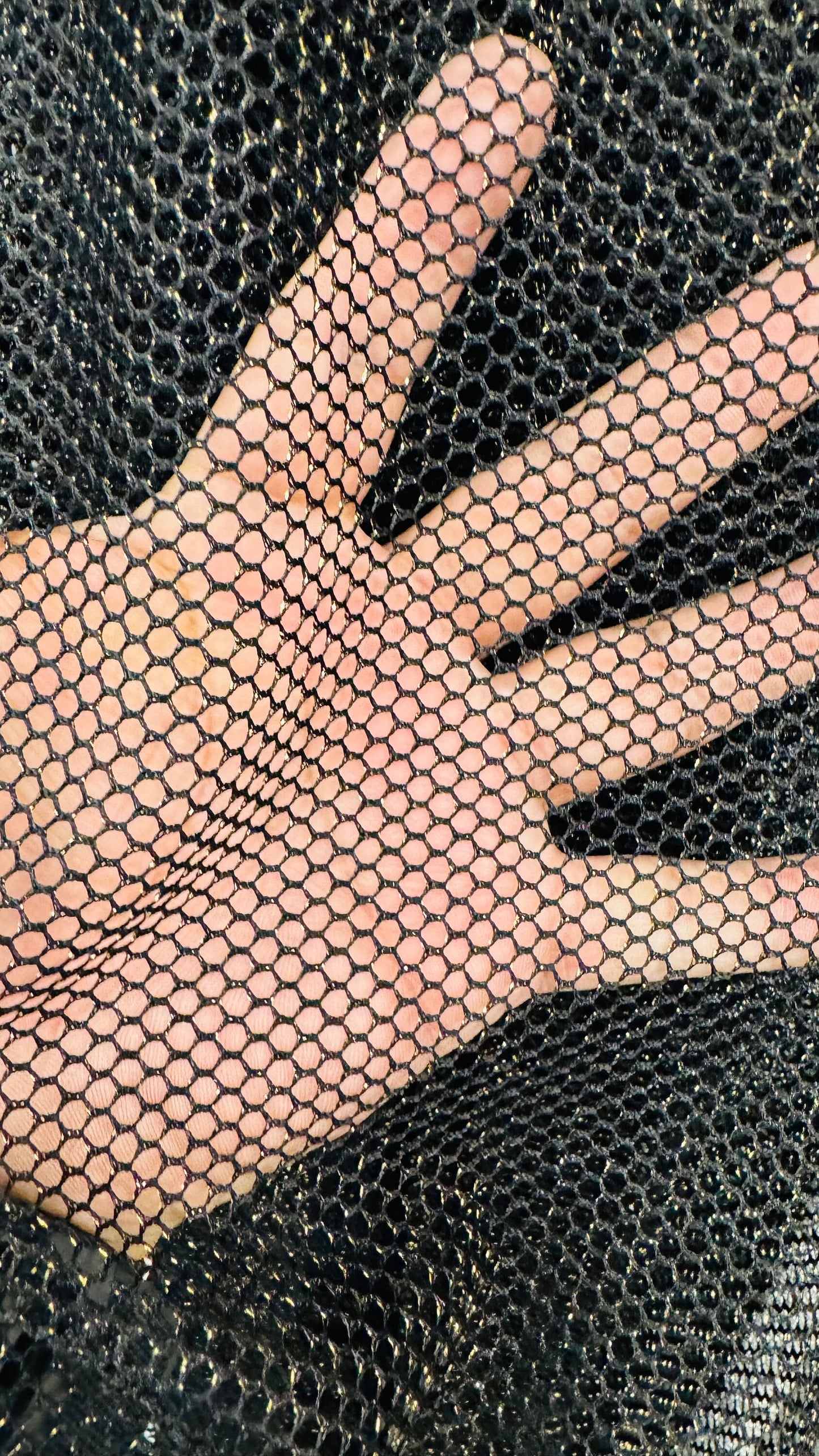 Metallic fishnet Black/gold 2-way stretch 58/60” Sold by the YD. Ships Worldwide from Los Angeles California USA.