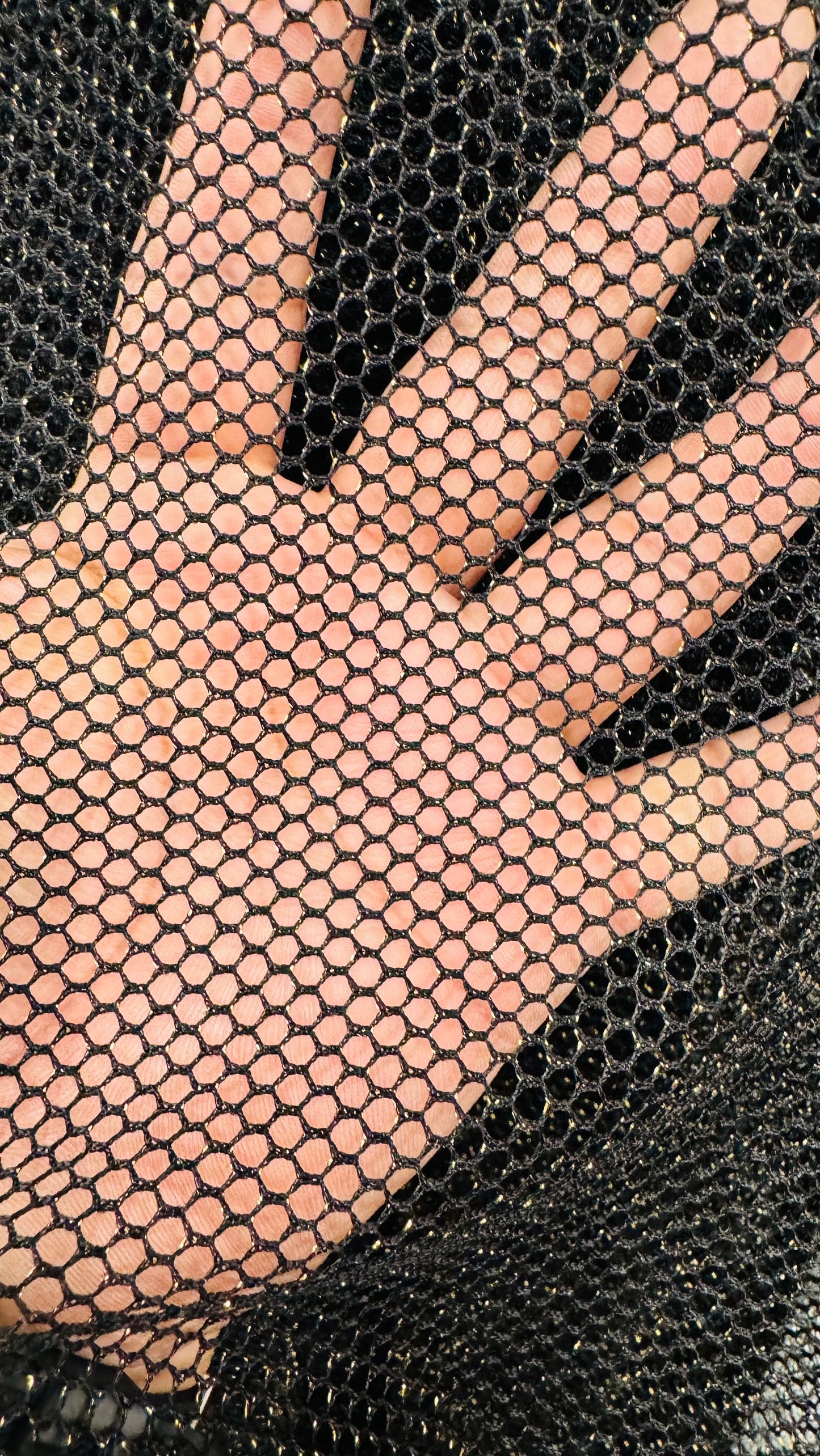 Metallic fishnet Black/gold 2-way stretch 58/60” Sold by the YD. Ships Worldwide from Los Angeles California USA.