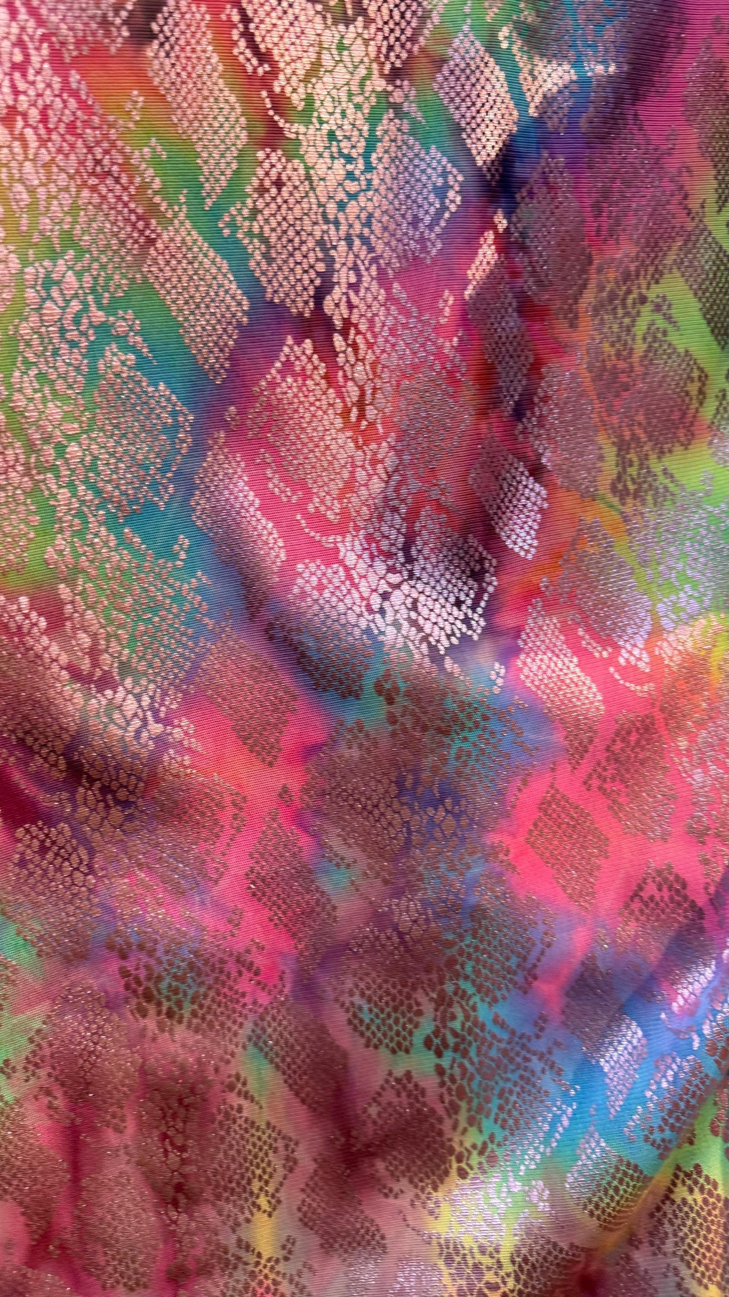 New exotic snake design print on tie dye metallic rainbow mesh 4-way stretch 58/60” Sold by the YD. Ships worldwide from Los Ángeles Ca