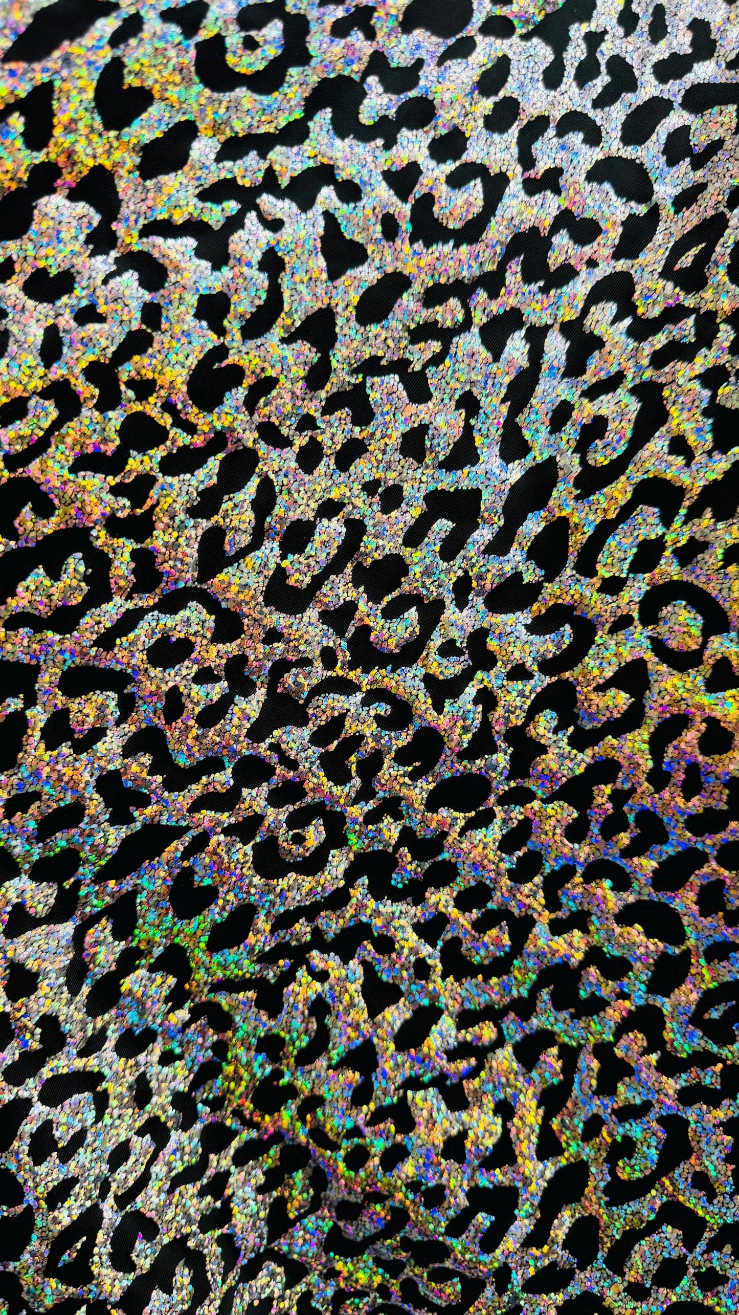 Hologram exotic leopard design metallic poly spandex 2-way stretch 58/60” Sold by the YD. Ships worldwide from Los Angeles California USA.