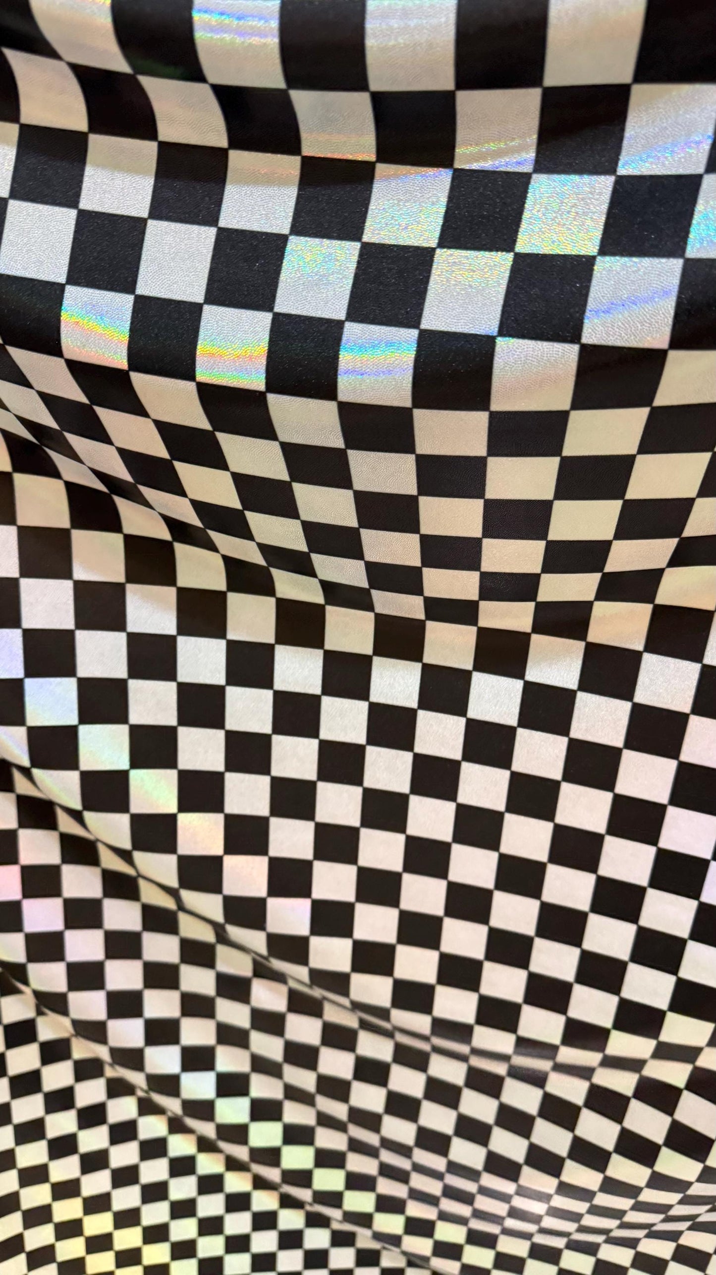 New Checkers Design iridescent W/Silver/Balck metallic nylon spandex 4-way stretch 58/60” Sold by the YD. Ships worldwide from Los Angeles