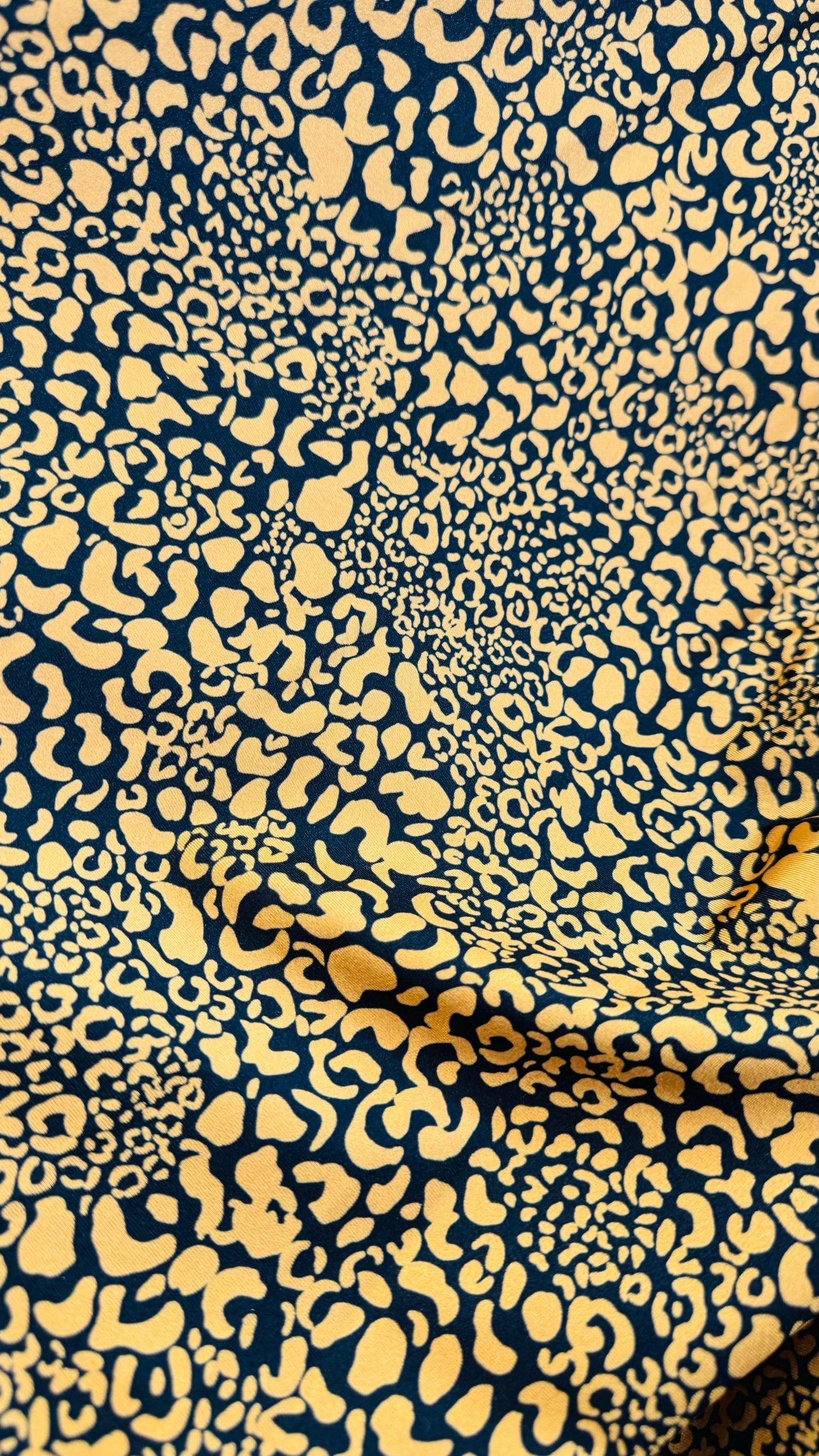 Exotic Leopard design Gold/Black print on best quality of nylon spandex 4-way stretch 58/60” Sold by the YD. Ships Worldwide from LA