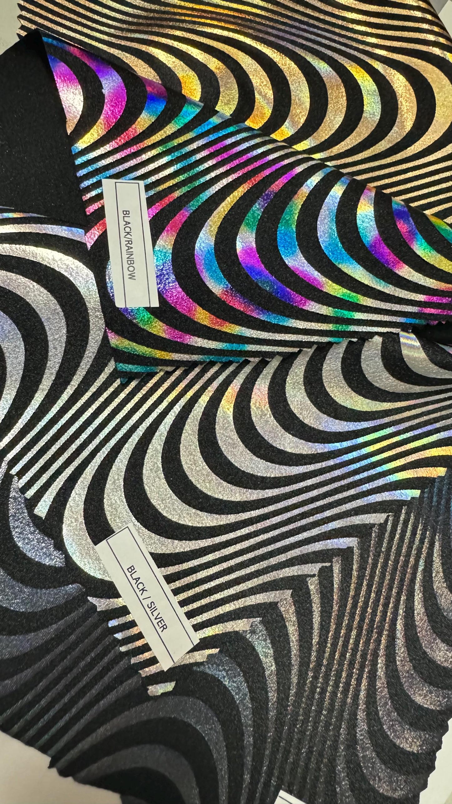 New abstract Wavy design print on great quality of Nylon spandex with iridescent foil 4-way stretch 58/60” Sold by the YD. Ships worldwide