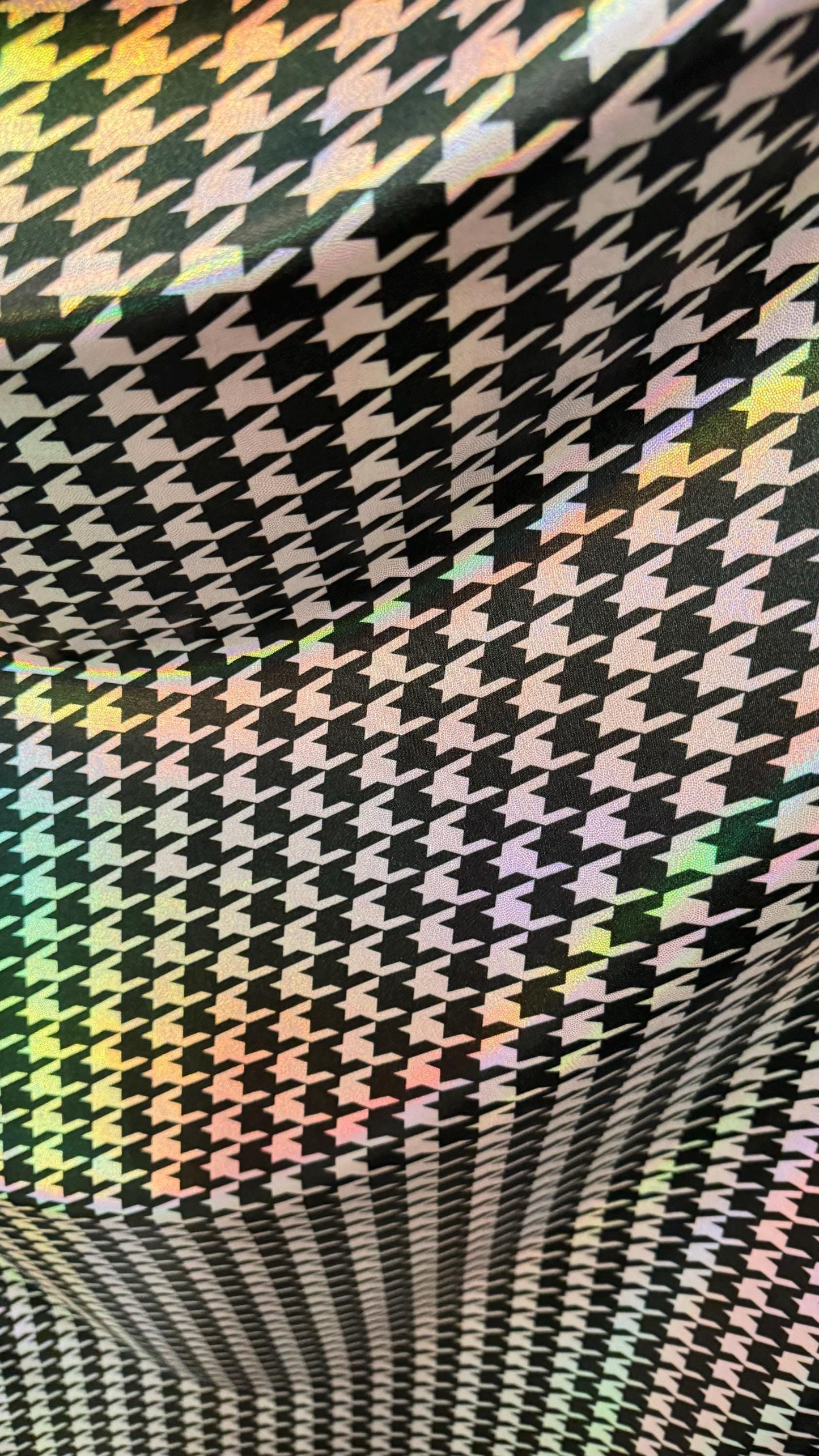 Houndstooth design nylon spandex with iridescent foil 4way stretch 58/60" Sold by the yd. Ships worldwide from Los Angeles California USA.