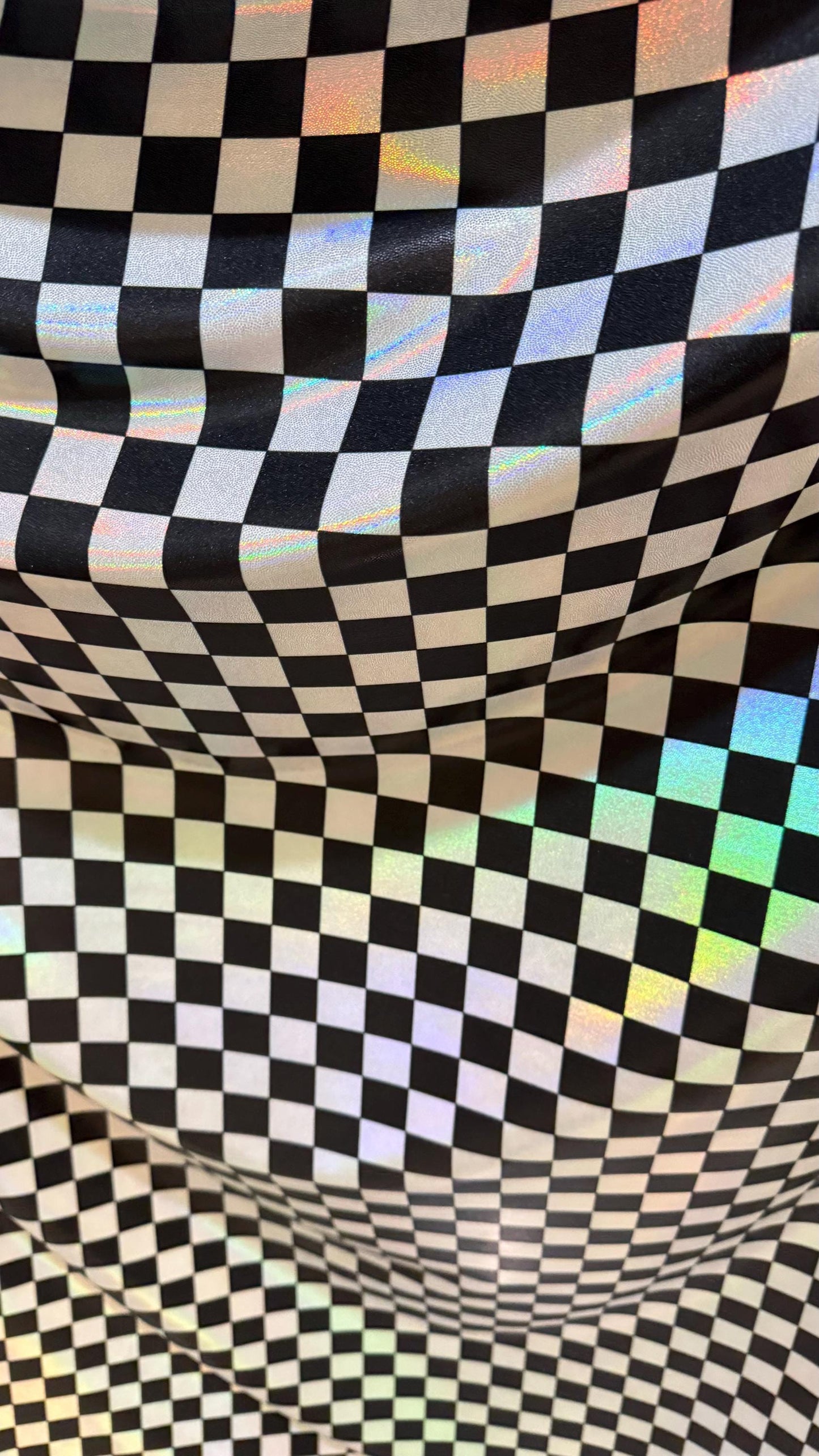 New Checkers Design iridescent W/Silver/Balck metallic nylon spandex 4-way stretch 58/60” Sold by the YD. Ships worldwide from Los Angeles