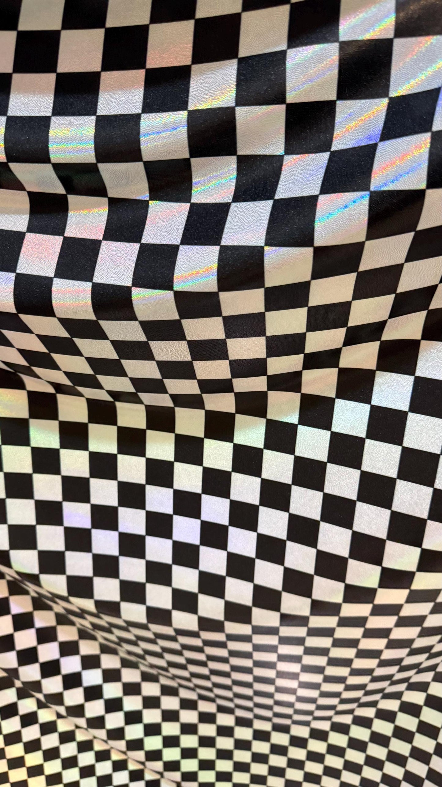 New Checkers Design iridescent W/Silver/Balck metallic nylon spandex 4-way stretch 58/60” Sold by the YD. Ships worldwide from Los Angeles