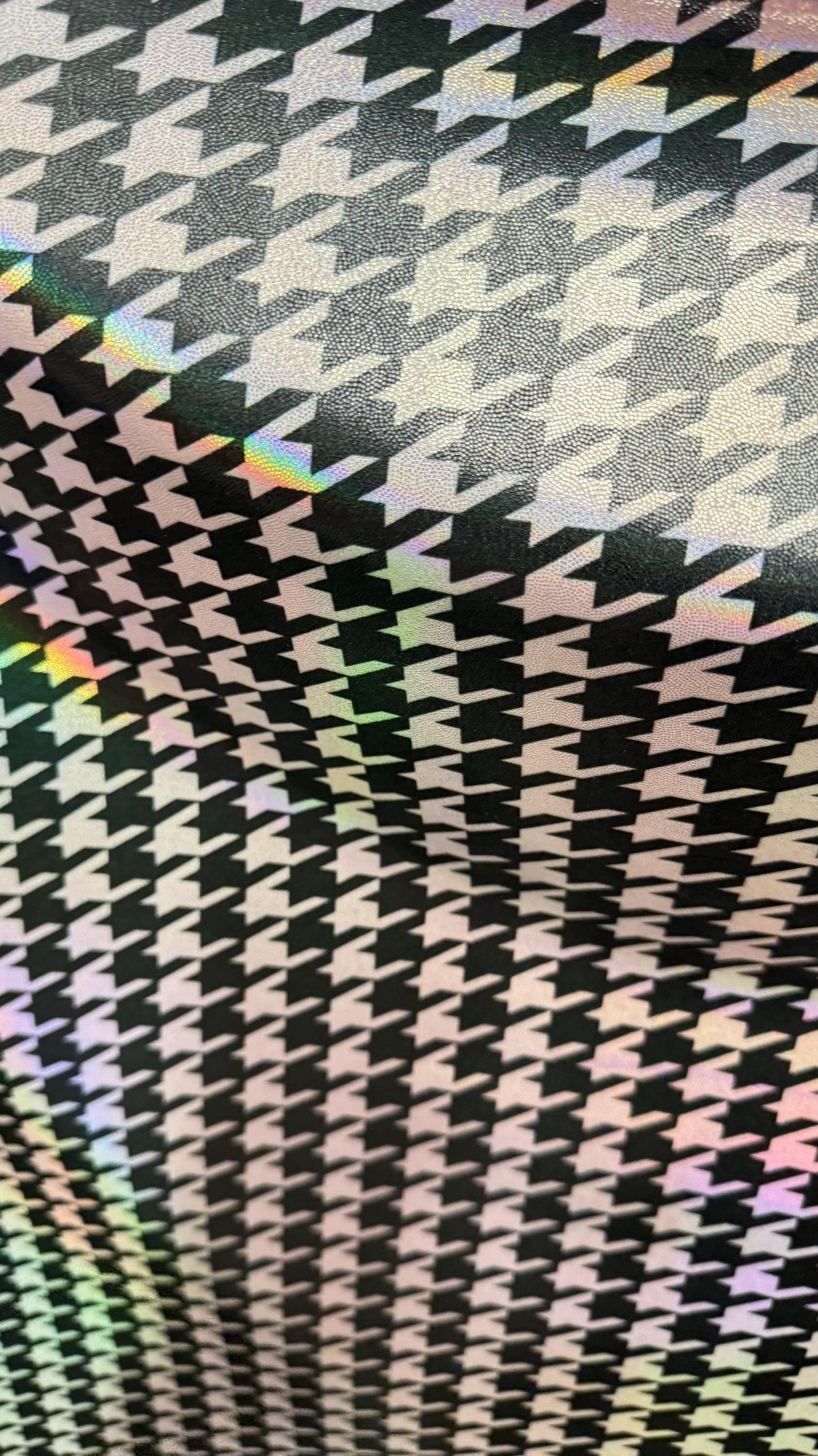 Houndstooth design nylon spandex with iridescent foil 4way stretch 58/60" Sold by the yd. Ships worldwide from Los Angeles California USA.