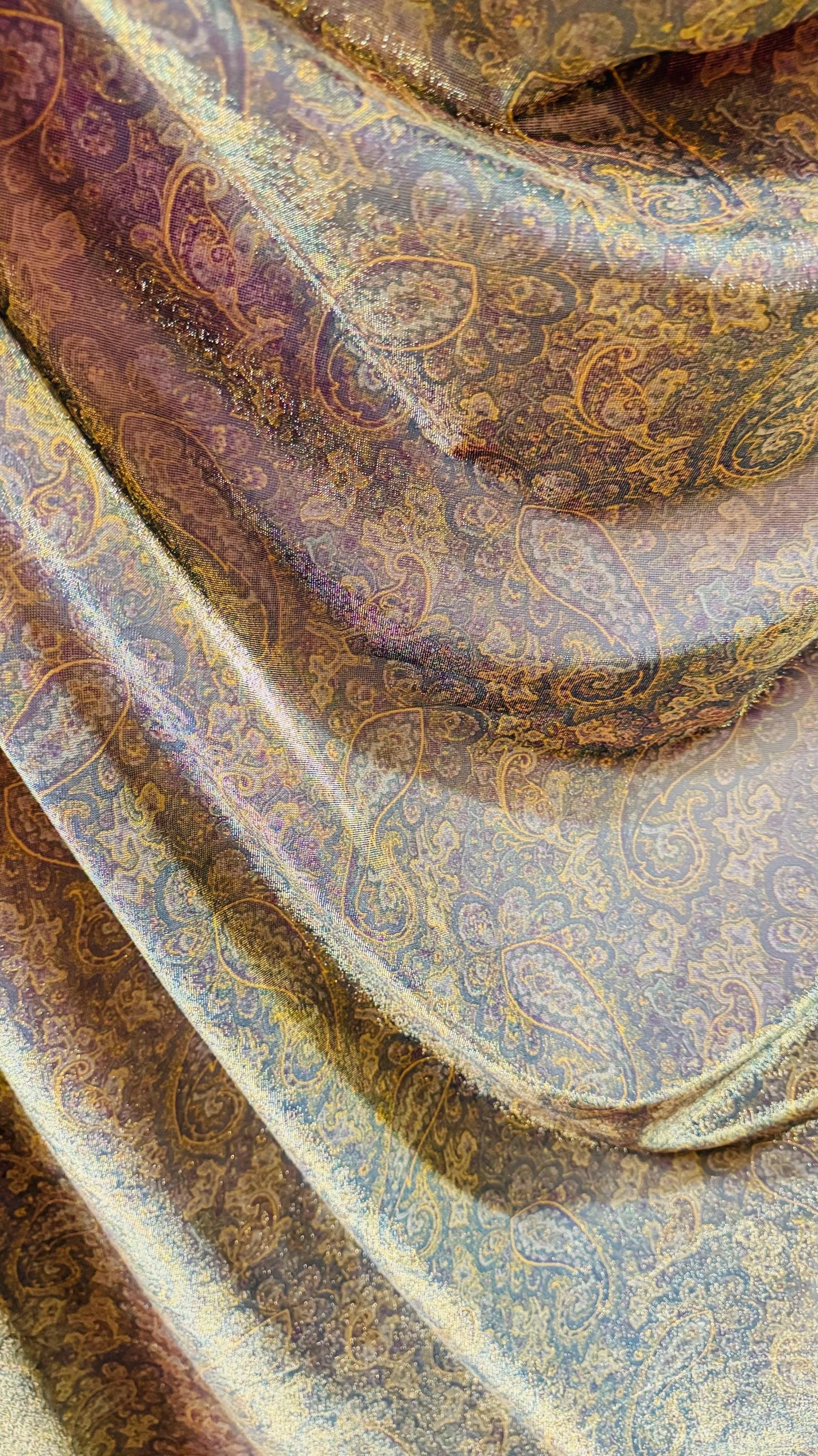 New metallic iridescent paisley mesh Gold/Multicolor 2-way stretch 58/60" Sold by the YD. Ships worldwide from Los Ángeles California USA.