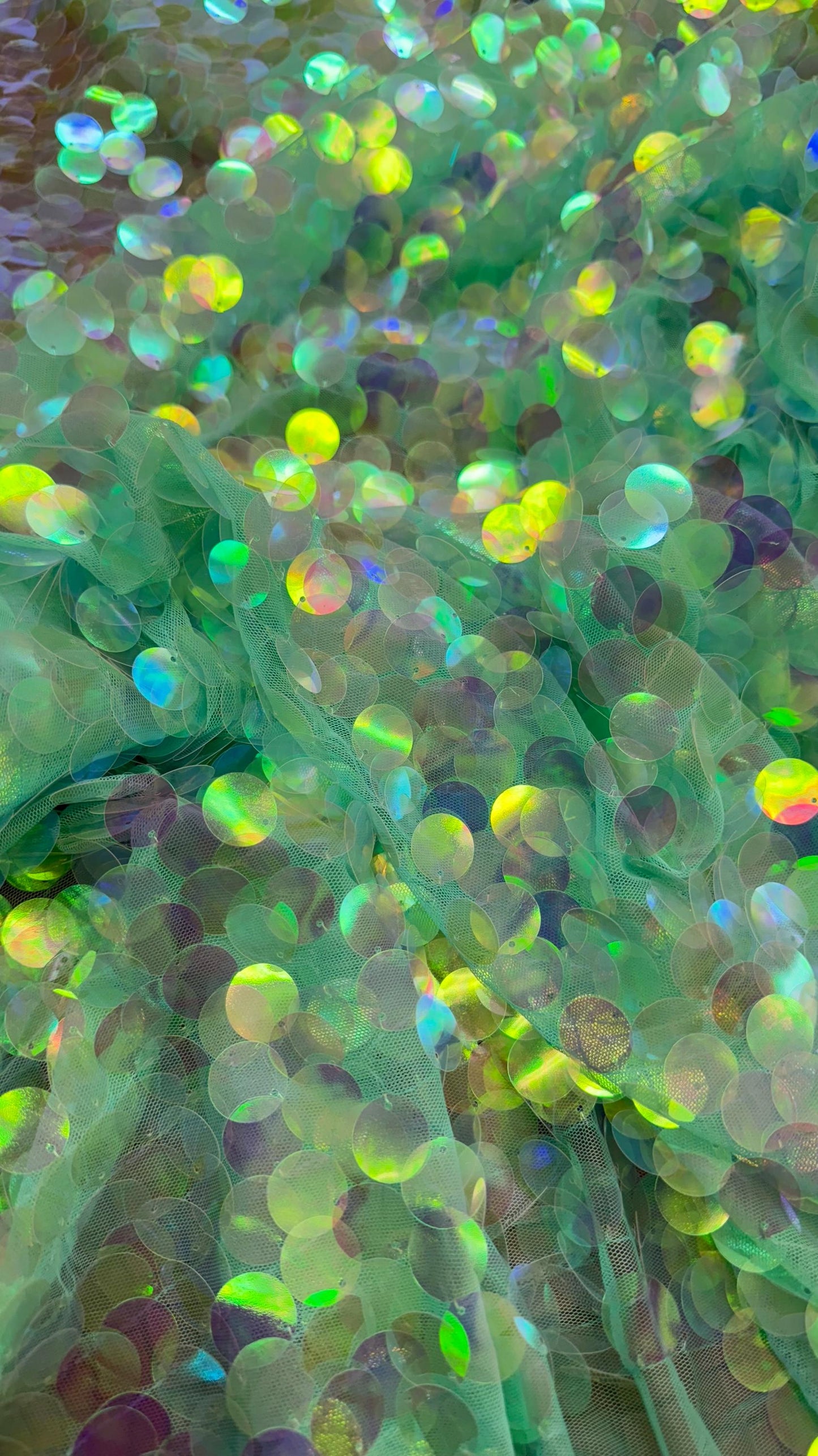 Iridescent aqua blue big Paillette on stretch mesh base 2 way stretch 58/60" Sold by the YD. Ships worldwide from Los Angeles CA.