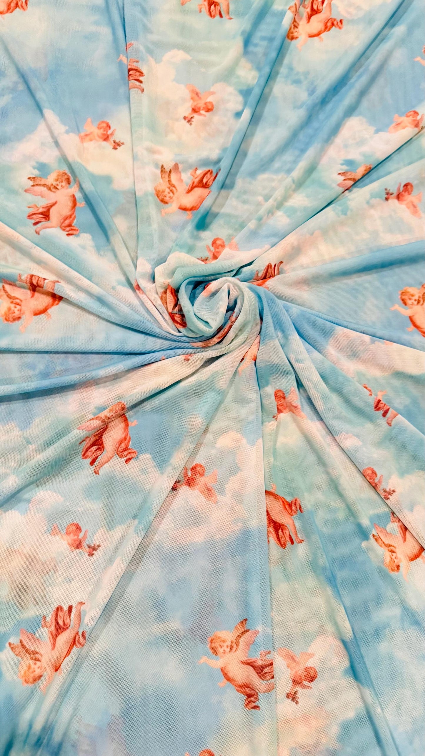 New Divine Angels design print on power mesh 4-way stretch 58/60” Sold by the YD. Ships worldwide from Los Angeles California USA.