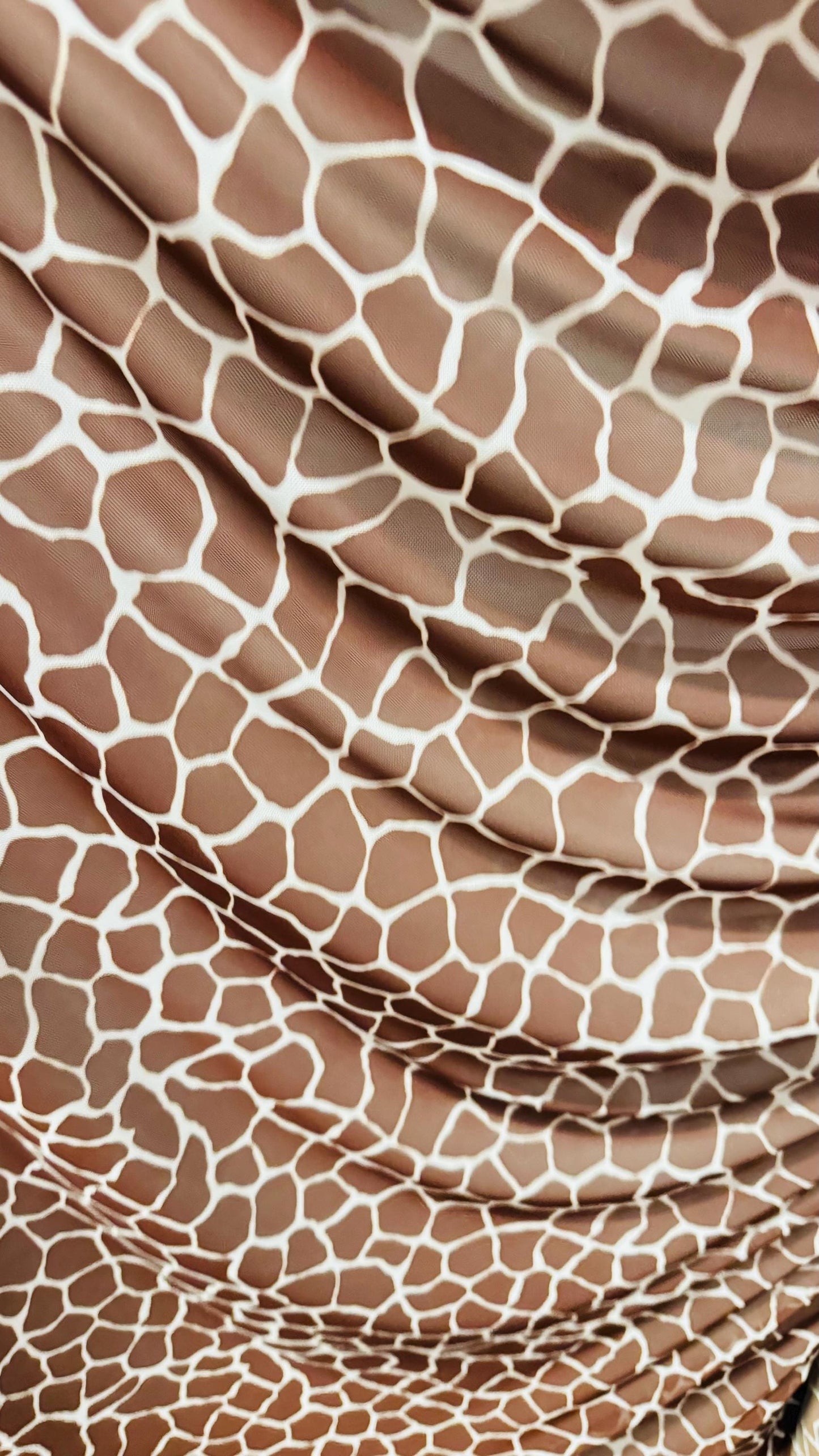 Giraffe design print on power mesh 4-way stretch 58/60” Sold by the YD. Ships Worldwide from Los Angeles California USA.