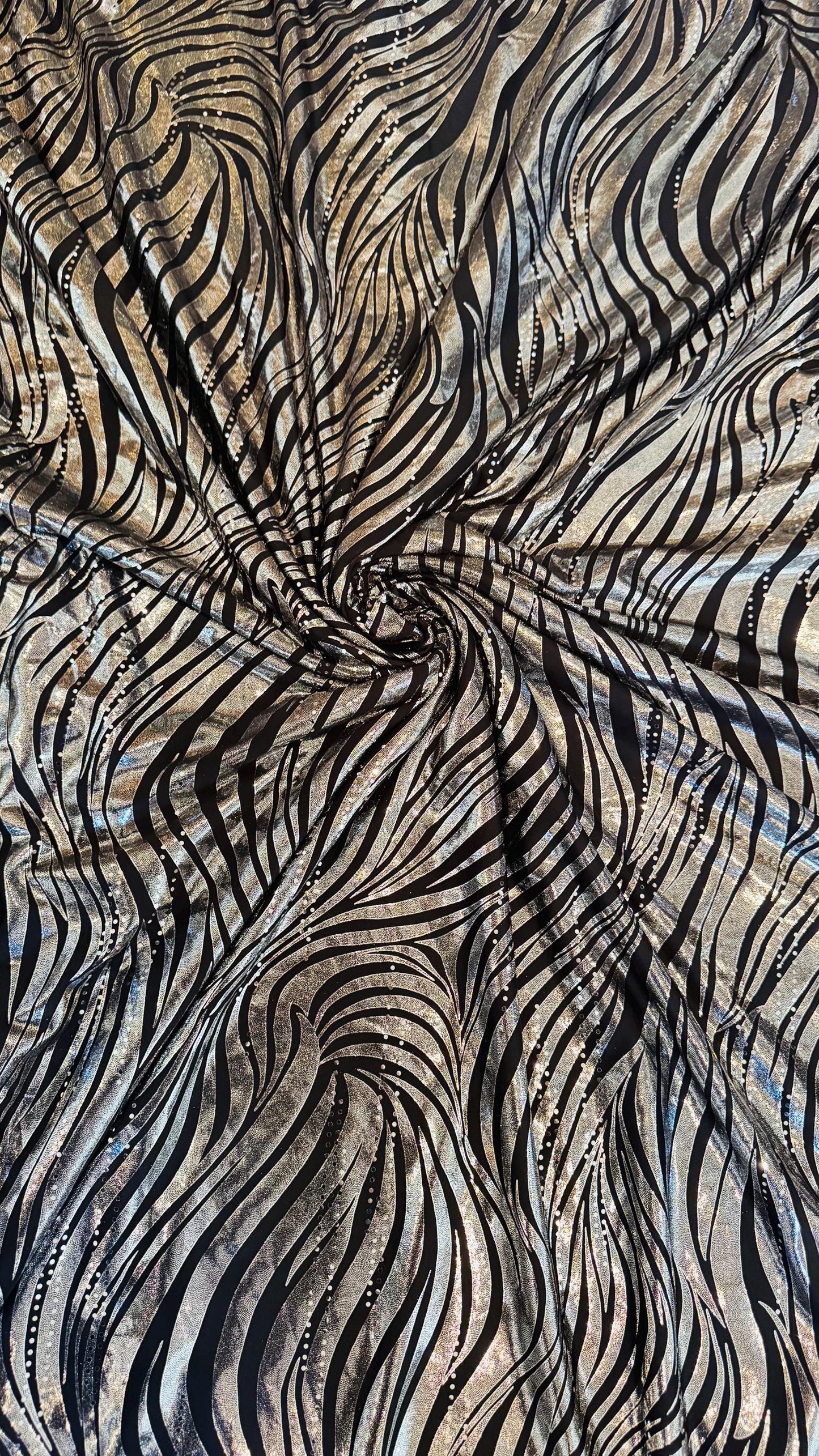 Zebra Metallic design poly spandex w/exquisite hologram foil 2way stretch 58/60" Sold by the YD. Ships worldwide from Los Angeles California