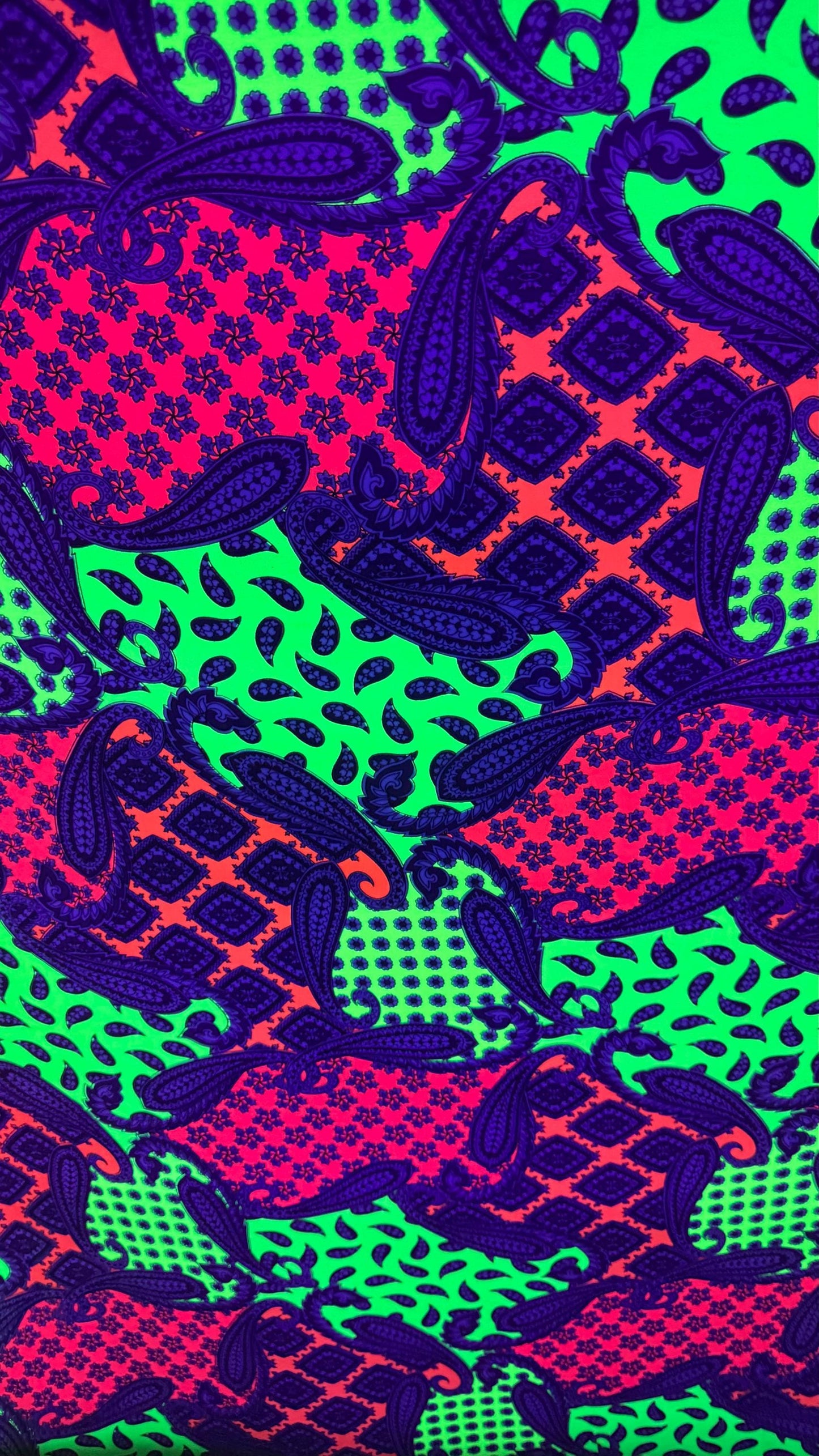 New paisley design Neon colors multicolor print on poly spandex jersey 4-way stretch 58/60” Sold by the YD. High quality fabrics