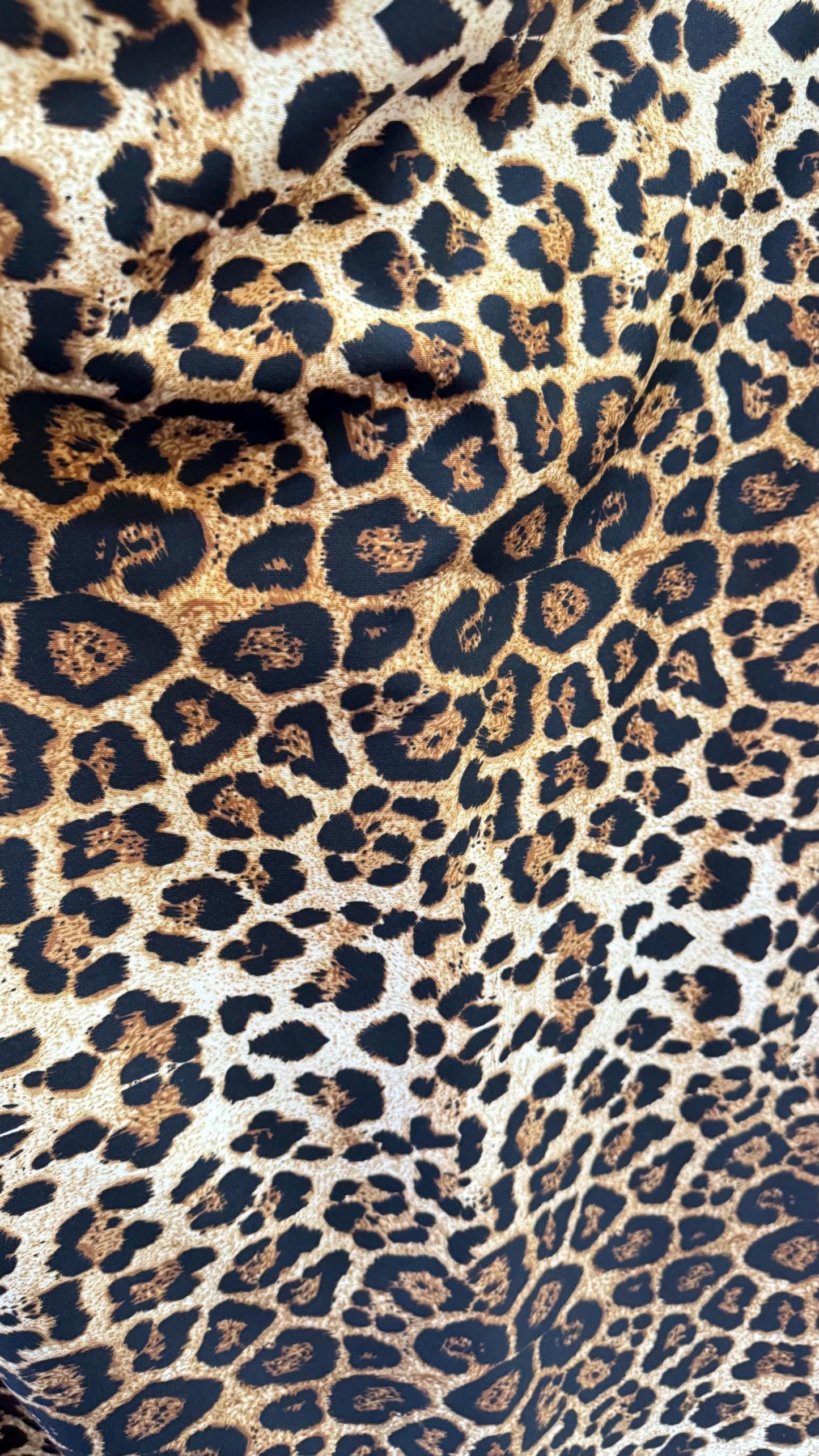 Wild Leopard Desig Brown/Gold on poly spandex techno 4way stretch 58/60" Sold by the YD. Ships worldwide from Los Ángeles California USA