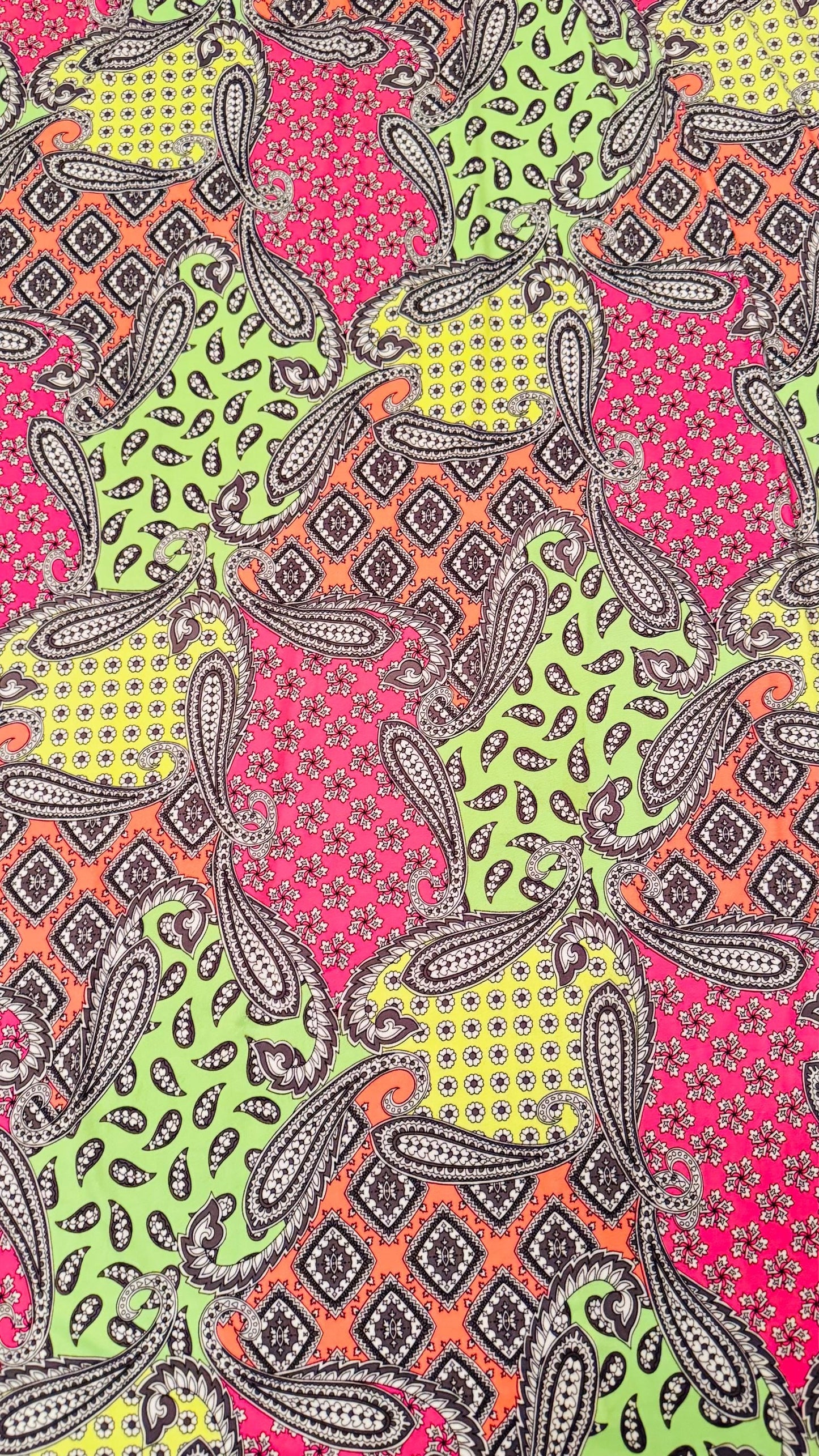 New paisley design Neon colors multicolor print on poly spandex jersey 4-way stretch 58/60” Sold by the YD. High quality fabrics