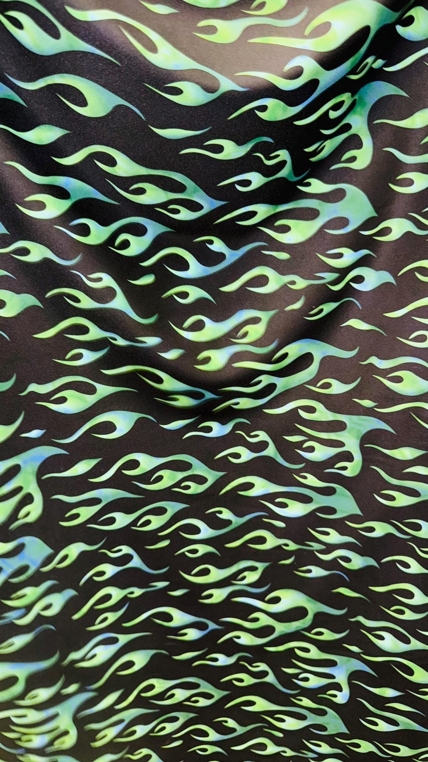 Hot flame design black/Green print on heavy nylon spandex 4way stretch 58/60" Sold by the YD. Ships worldwide from Los Angeles California